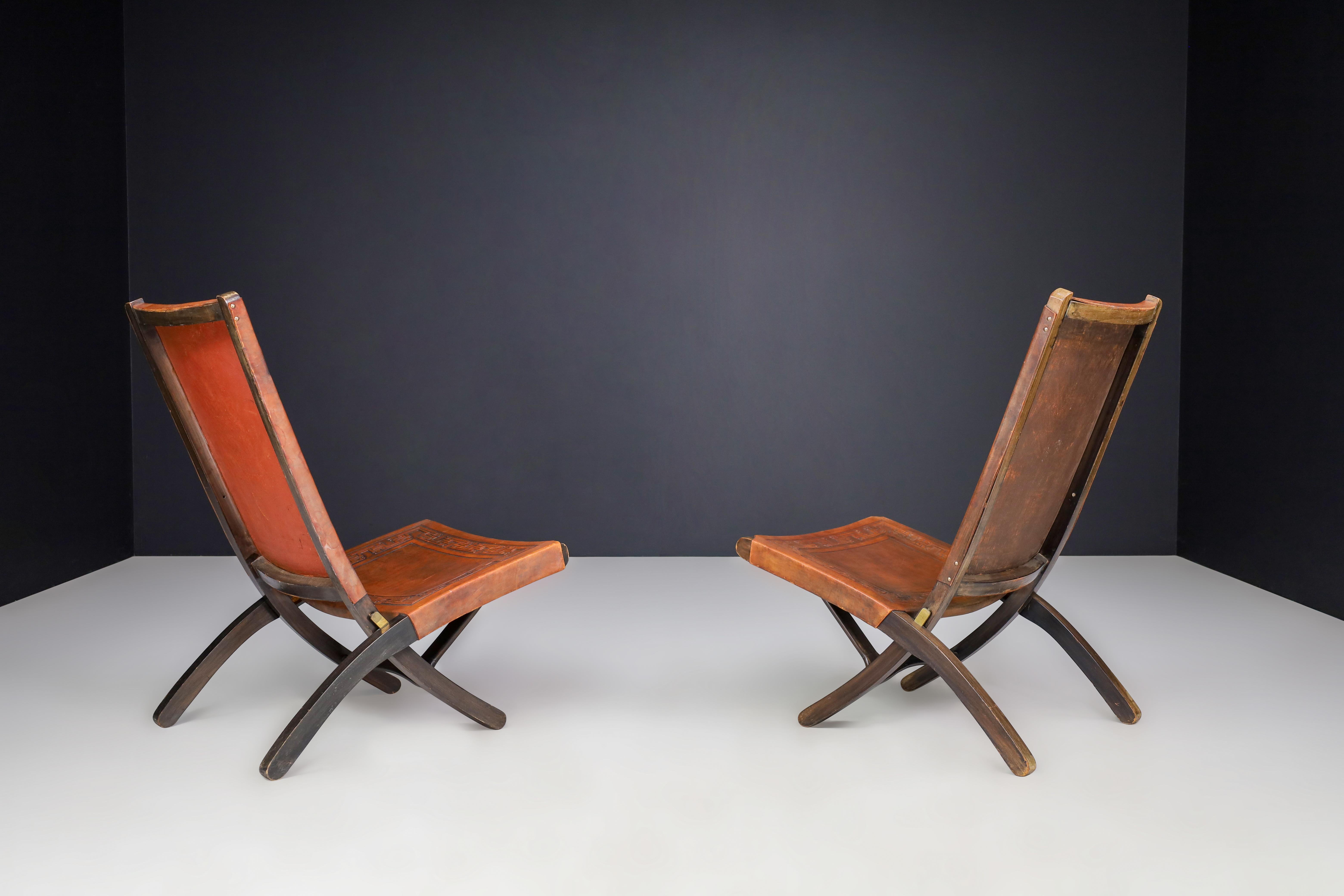 Late 20th Century Angel I. Pazmino Cognac-colored Saddle Leather Folding Chairs Ecuador 1970s   For Sale