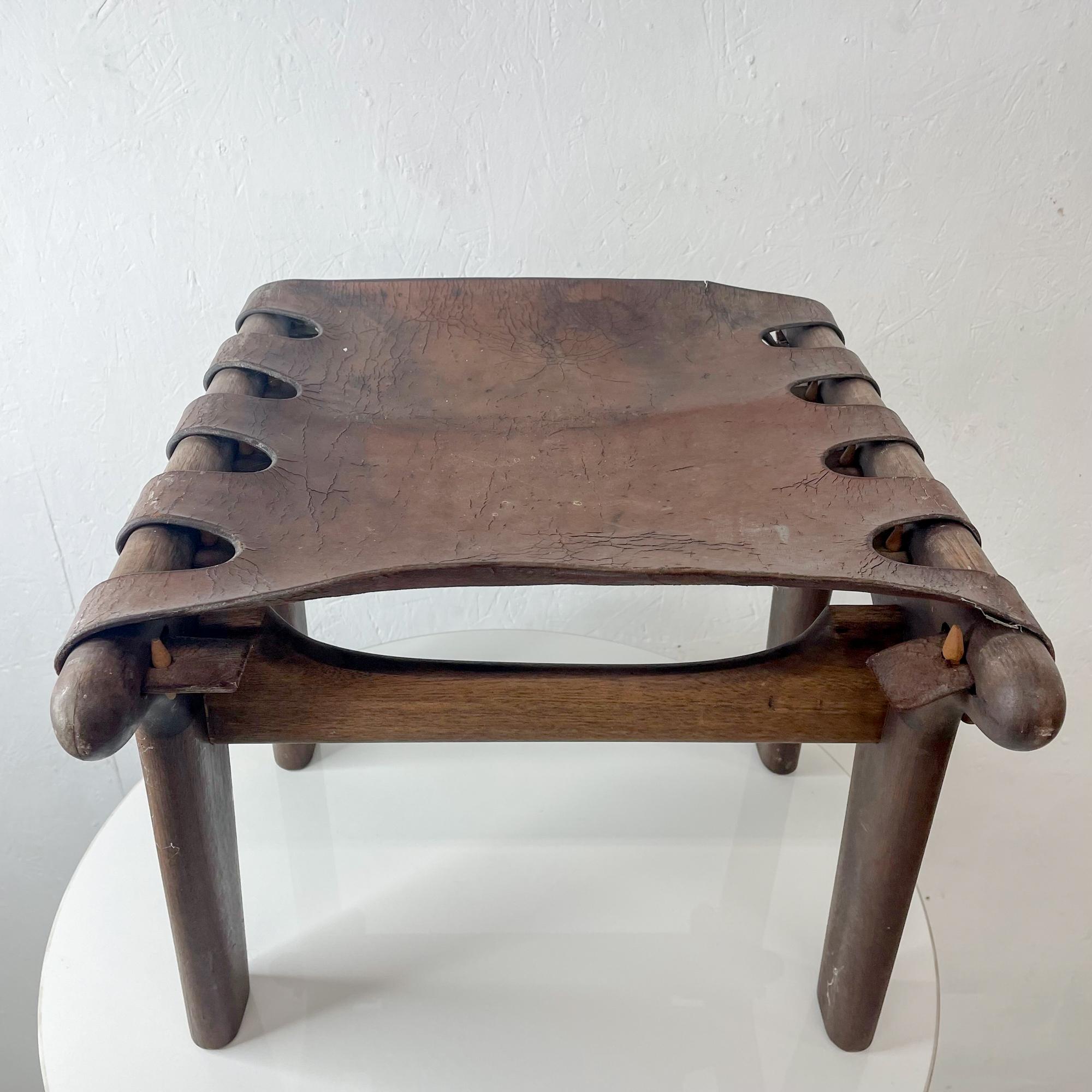 Pazmino stool
Fabulous vintage footrest stool ottoman designed by Angel Pazmino of Ecuador 1960s.
Designed in Solid sculptural wood a la Nakashima with Leather Strappy top in whip stitch.
14 H x 17.75 D x 19 W inches
Preowned Original vintage