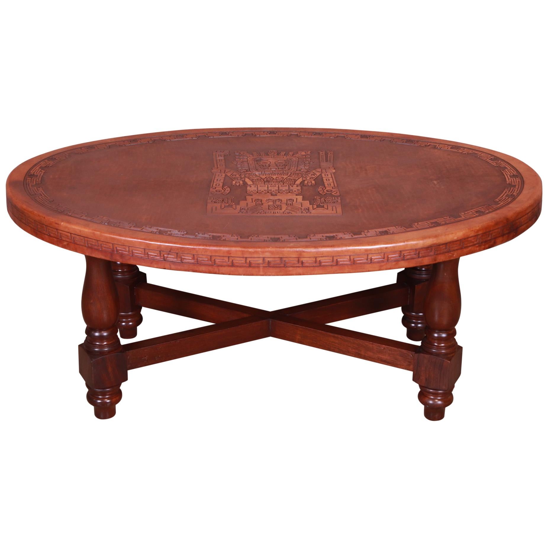 A rare and exceptional midcentury South American modernist coffee table

By Angel Pazmino for Muebles de Estilo

Ecuador, 1960s

Carved solid mahogany legs and stretchers, with tooled leather top with unique embossed Incan