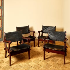 Angel Pazmino, Suite of four armchairs, leather and wood, circa 1960, Ecuador.