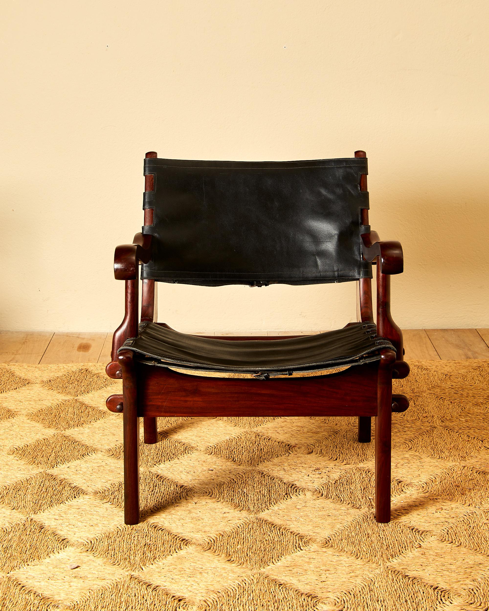 Unknown Angel Pazmino, Suite of four armchairs, leather and wood, circa 1960, Ecuador. For Sale