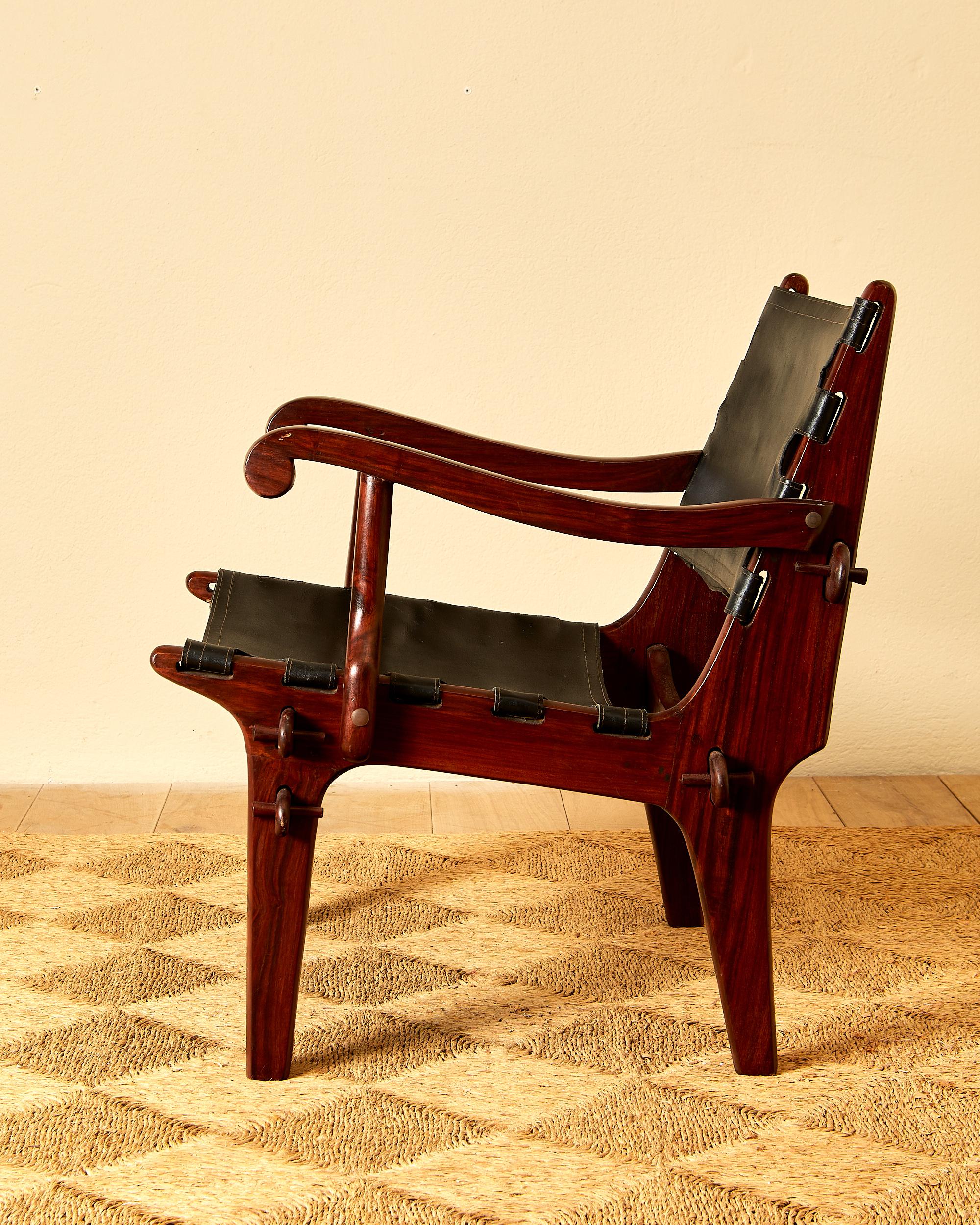Mid-20th Century Angel Pazmino, Suite of four armchairs, leather and wood, circa 1960, Ecuador. For Sale