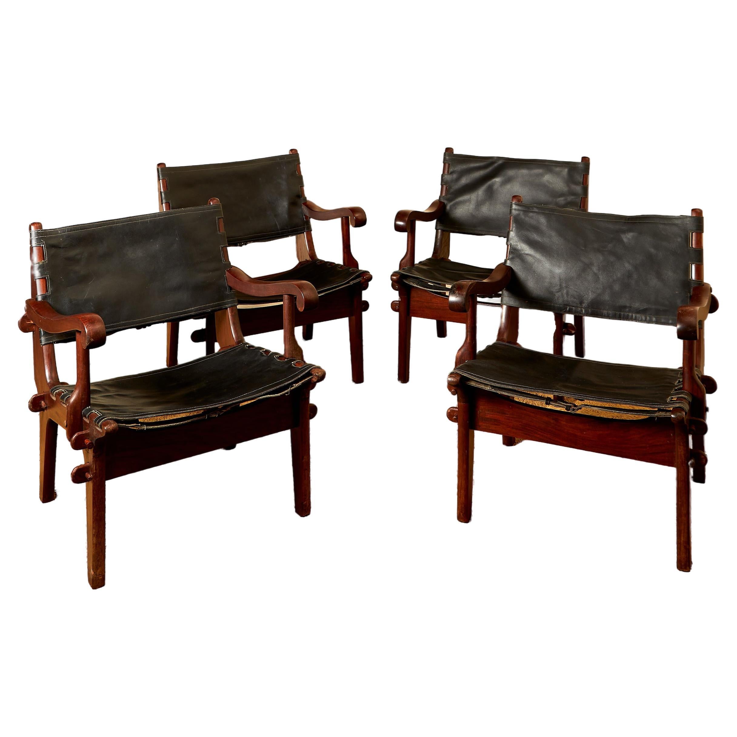 Angel Pazmino, Suite of four armchairs, leather and wood, circa 1960, Ecuador. For Sale