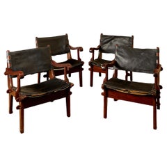 Angel Pazmino, Suite of four armchairs, leather and wood, circa 1960, Ecuador.