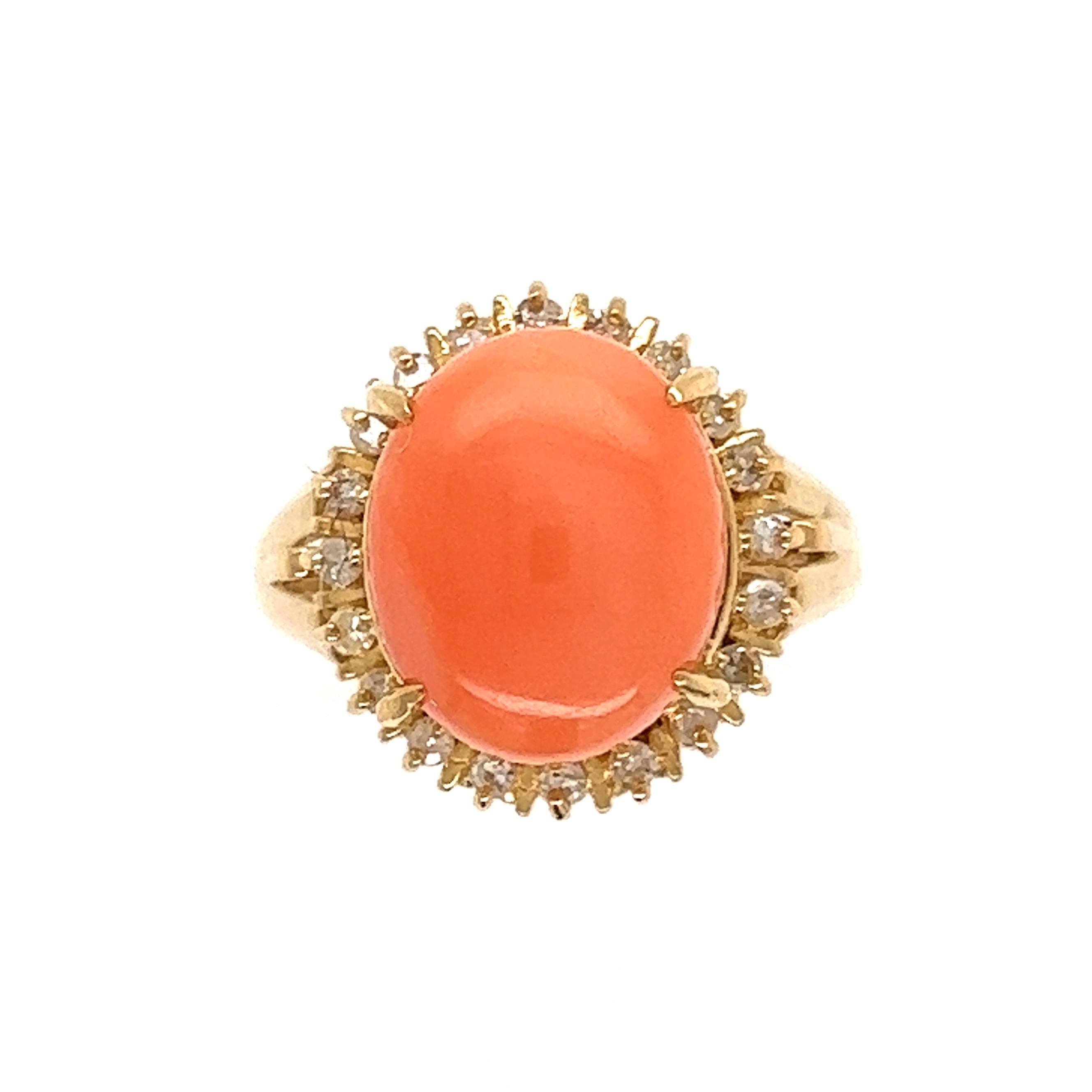 Beautiful Angelskin Coral and Diamond Cocktail Ring. Center securely set with a Cabochon Angelskin Coral, surrounded by Diamonds, weighing approx. 0.21tcw. Hand crafted 18K Yellow Gold mounting. Approx. dimensions: 1.11