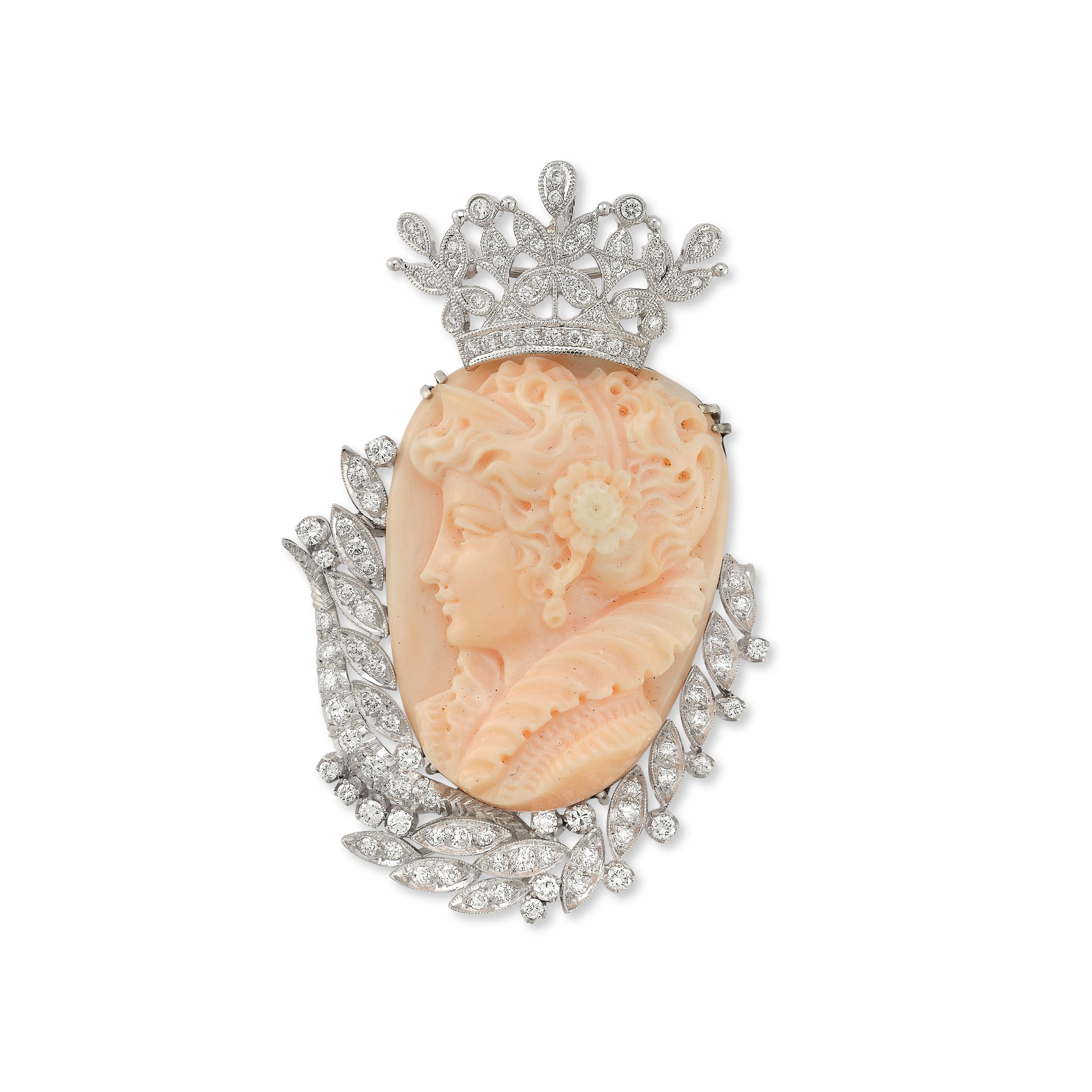 Angel Skin Coral Cameo & Diamond Brooch Pendant

18k white gold pin set with a carved coral face framed by 104 round diamonds 

Measurements: 2.5