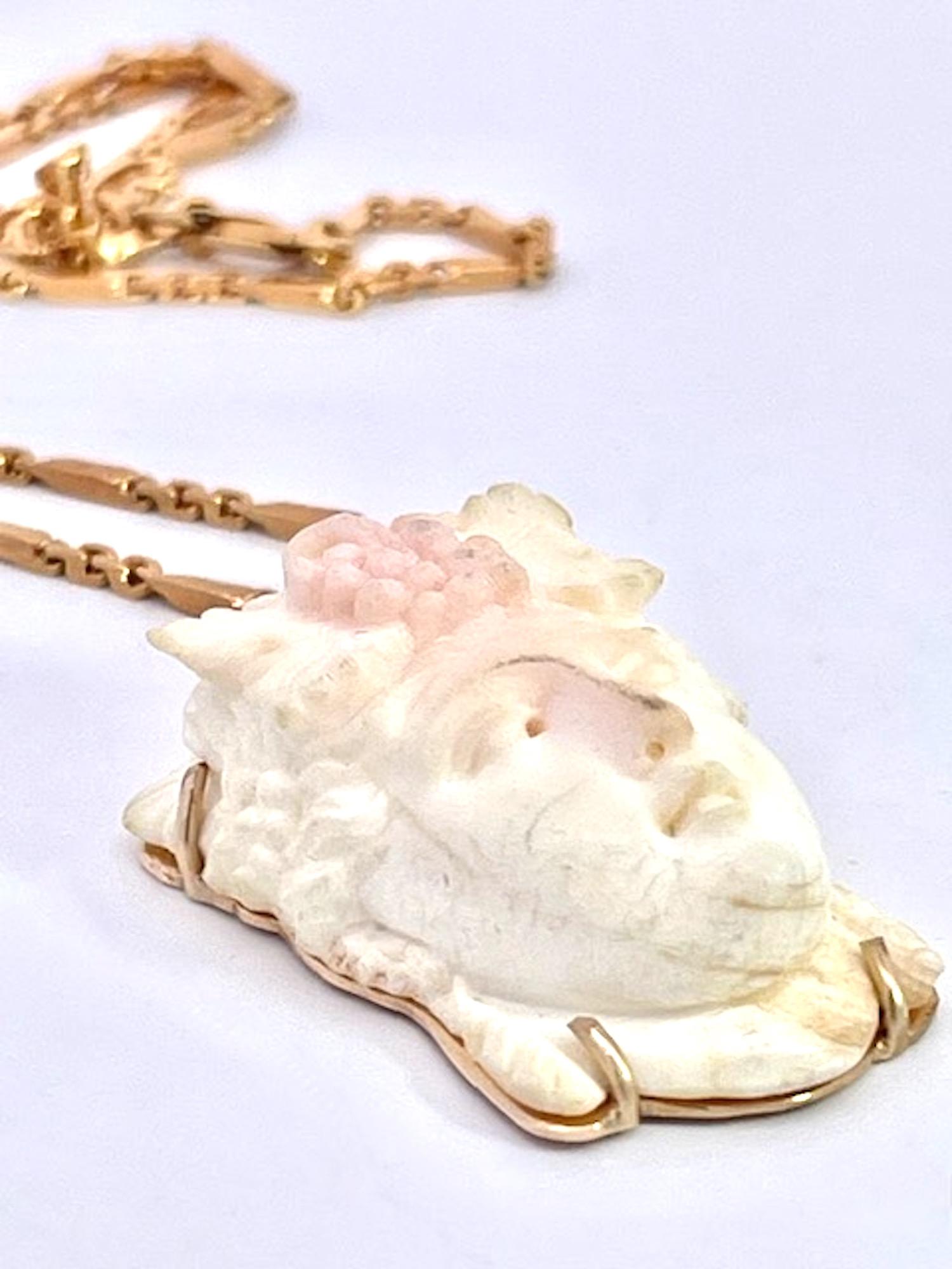 
This gorgeous pendant matches the earrings listed.  These are carved Angel Skin Coral with an exquisite carving of a women's face. This chain is gorgeous and is 14K Yellow Gold as is the earings mounting. Beautiful set, this is for the pendant