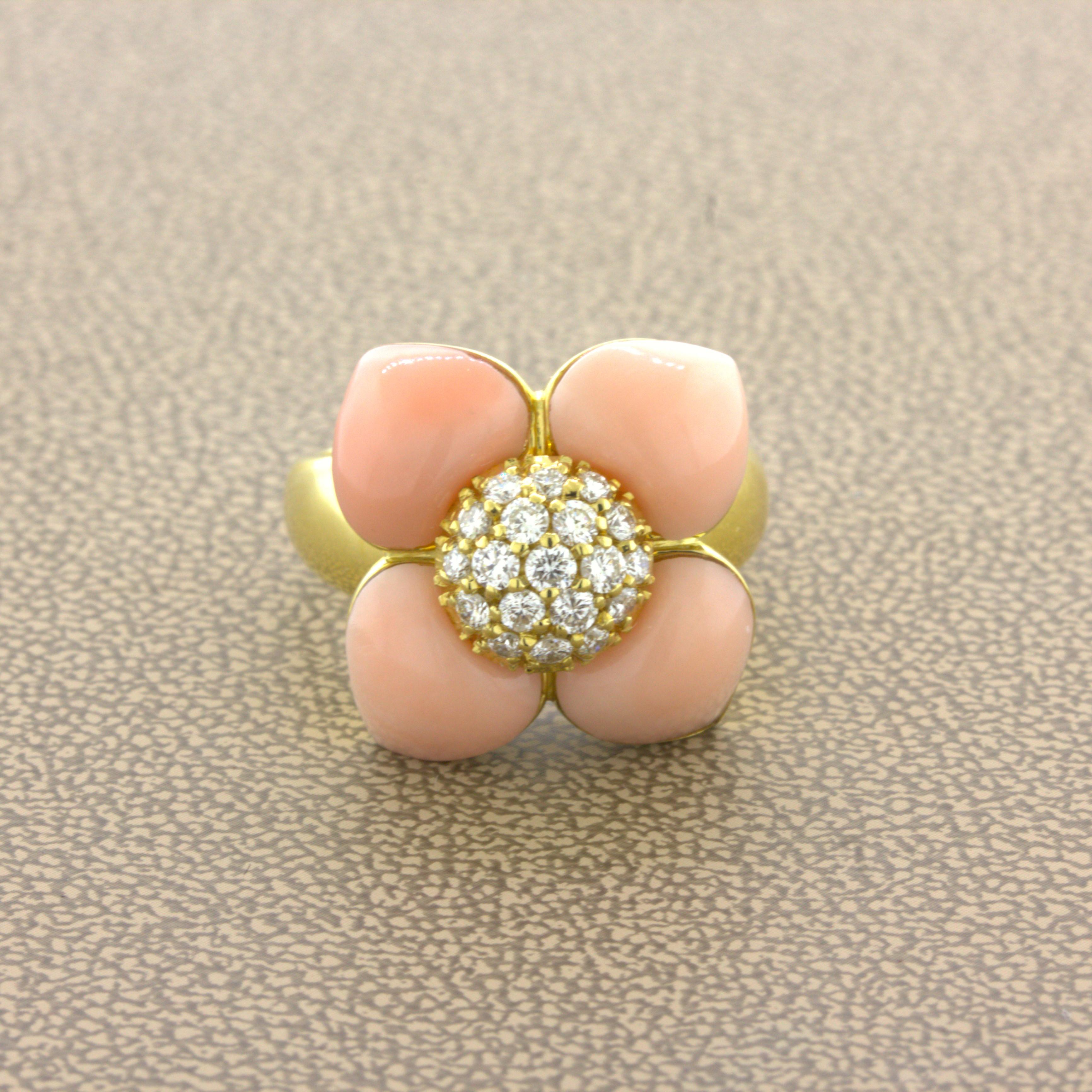 Angel-Skin Coral Diamond 18K Yellow Gold Flower Ring

A sweet and stylish yellow gold ring featuring 4 angel skin coral flower pedals. The coral have a soft luscious pink color with excellent luster giving it the trade name “angel skin.” It is
