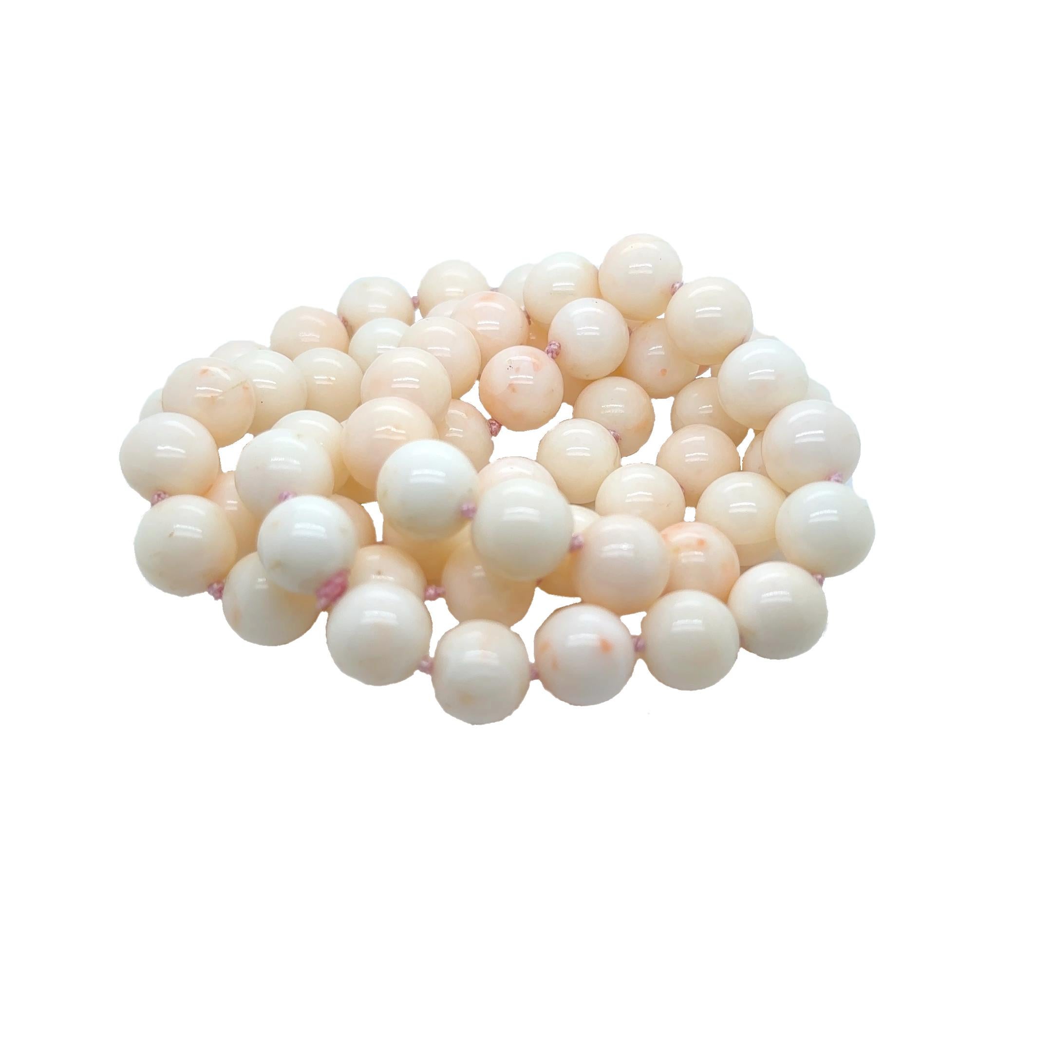 VERY RARE- Gorgeous high quality, vintage Japanese angel skin coral 32-inch continuous hand knotted necklace with 62 beautiful, extra-large l 12.5 MM round beads in the same size and very uniform in shape, color and luster.  The exquisite beads are