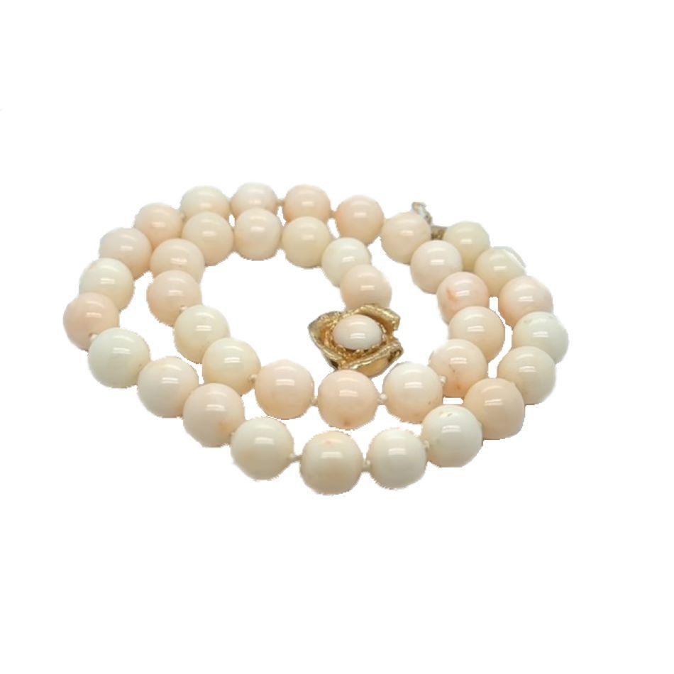 A Gorgeous, 16-inch angel skin coral necklace with 14karat yellow gold and cabochon Angel Skin Coral clasp. Each bead measures 9.30 MM all evenly matched for color, luster and size. 

There are 39 beads strung on silk for this very wearable