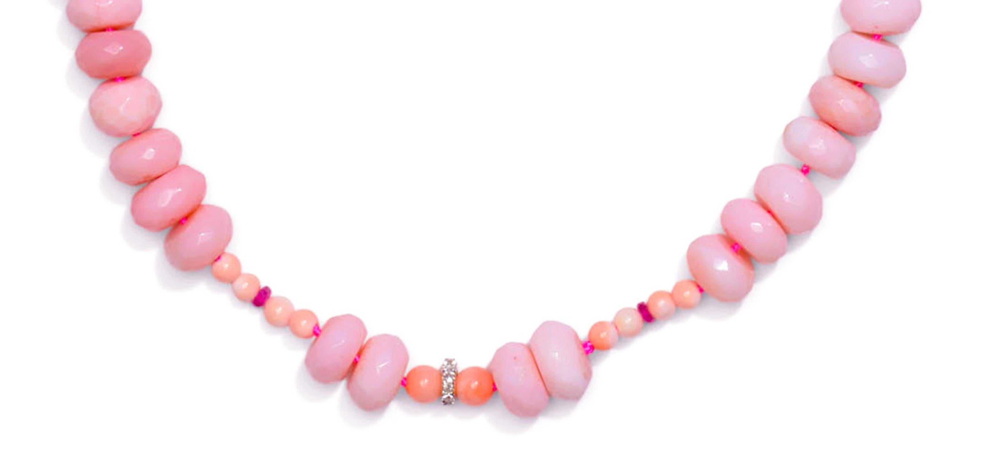 Baby Pink Peruvian Opal Necklace encriched with diamonds, pink sapphires and angel skin corals. Methiciously hand knotted on pink thread.

Treat yourself to a magical, ethereal look with this Pink Peruvian Opal Necklace. It's adorned with pink