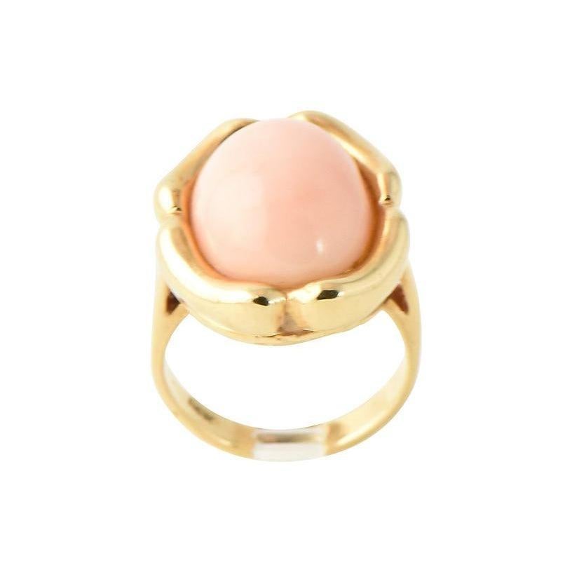 Highly stylized 14K gold ring with bamboo-style mount surrounding an oval angel skin coral cabochon. Coral: 15.5mm x 12mm. U.S. size: 5; can be sized. Marked: 14K.