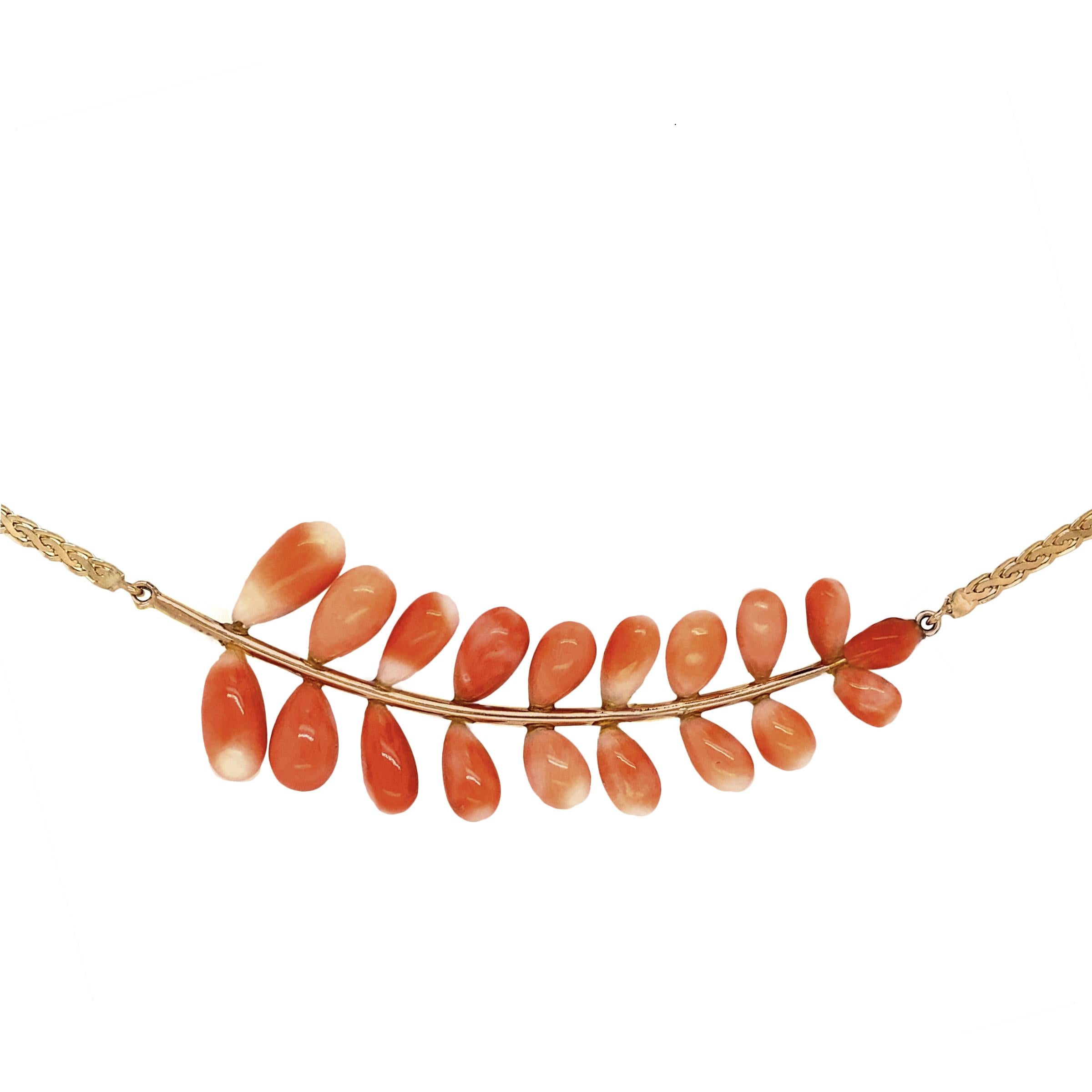 This sprig of richly hued angel skin coral buds was originally a brooch, probably made in the 1960s or early 1970s.  Oriented horizontally, Eytan Brandes recognized an interesting graduated shape and converted the pin to a sexy, one-of-a-kind