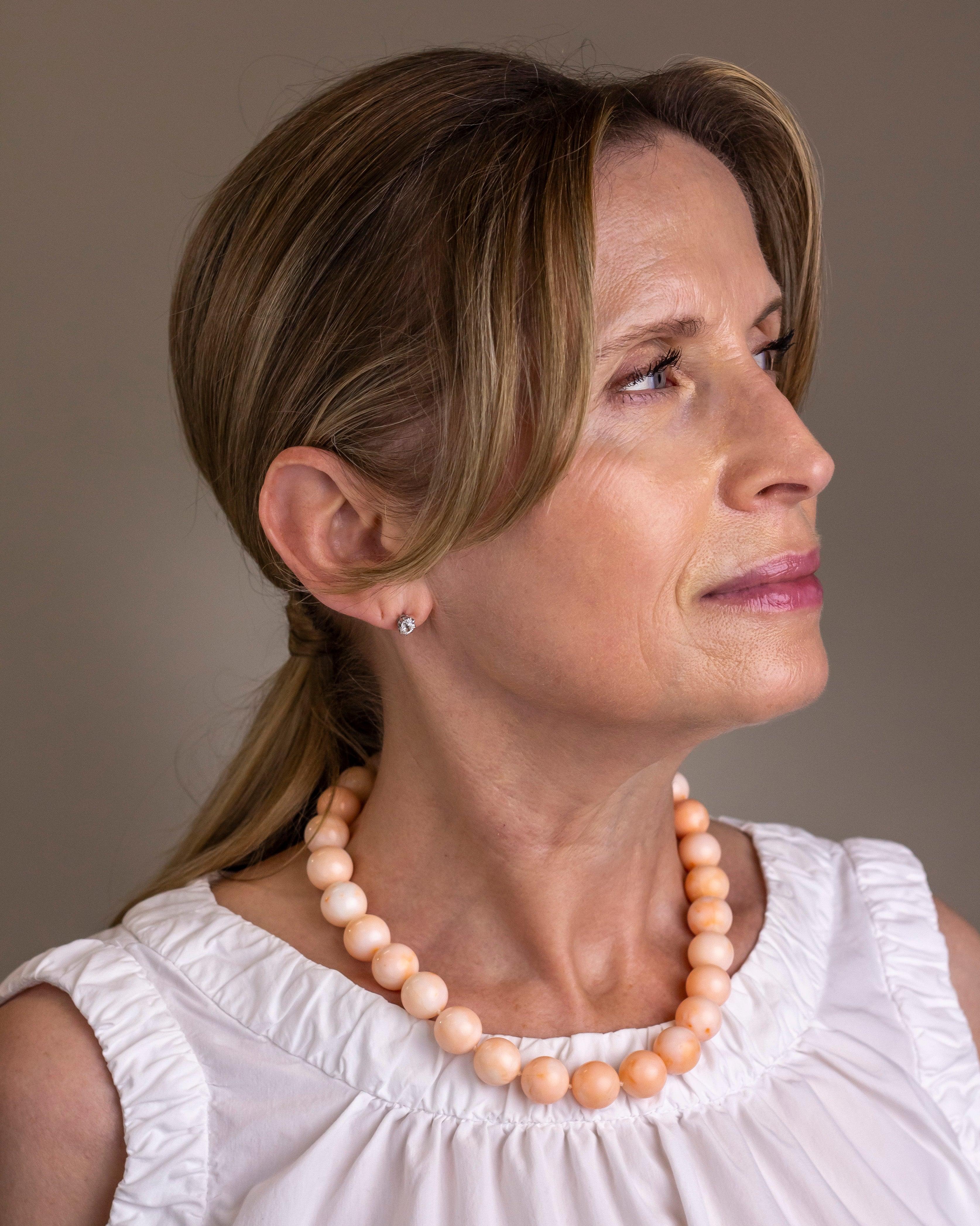This exceptional strand of angel-skin coral are the most beautiful colour and have been beautifully matched to create a fine necklace. Each of the coral beads measures between 14 and 15 millimetres in diameter and totals 27 pieces which have been