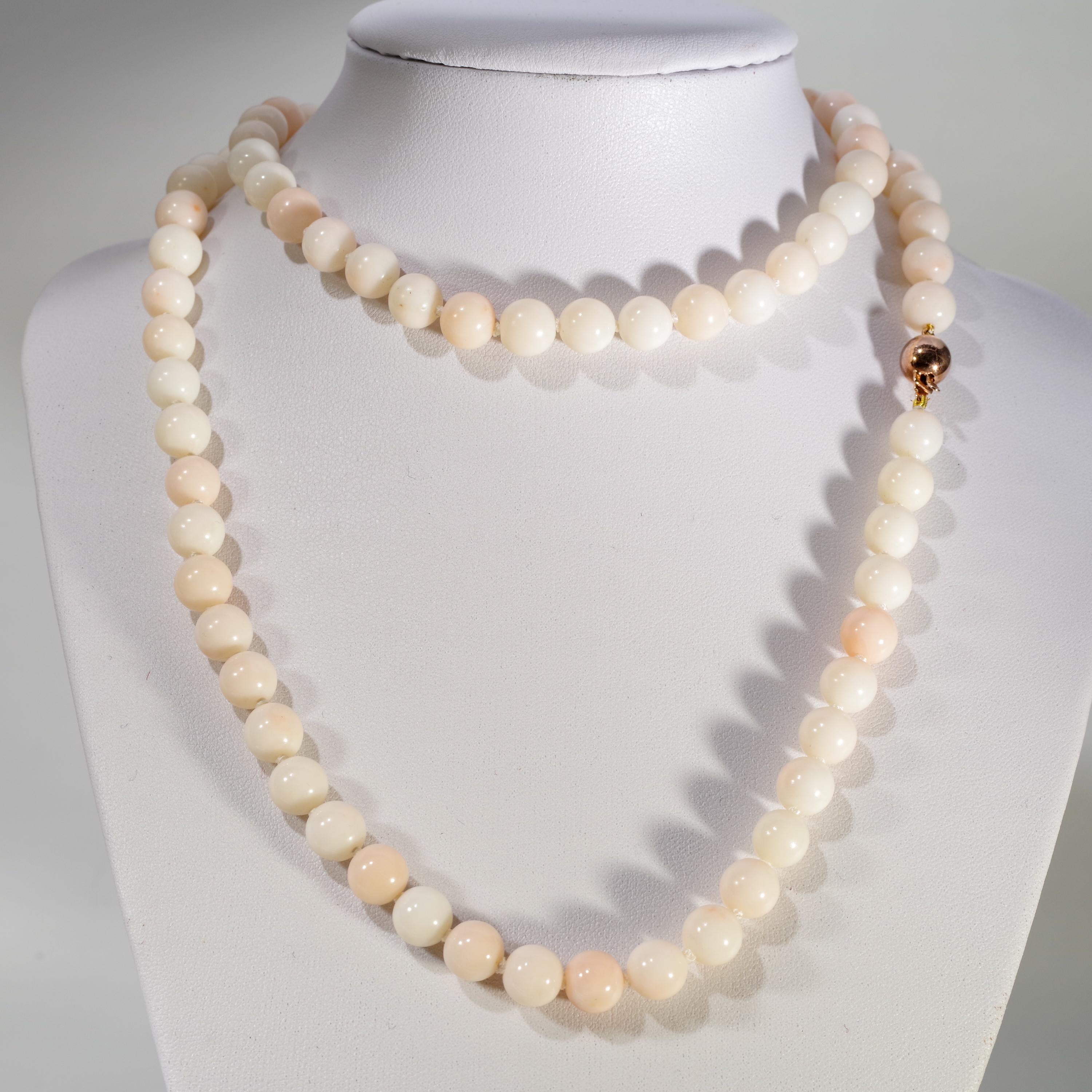 This is an exceedingly fine-quality opera-length necklace of large( 6 mm) certified natural and untreated angel skin precious coral beads that were hand-carved and polished to create this glorious jewel from the sea. The beads date to the 1950s