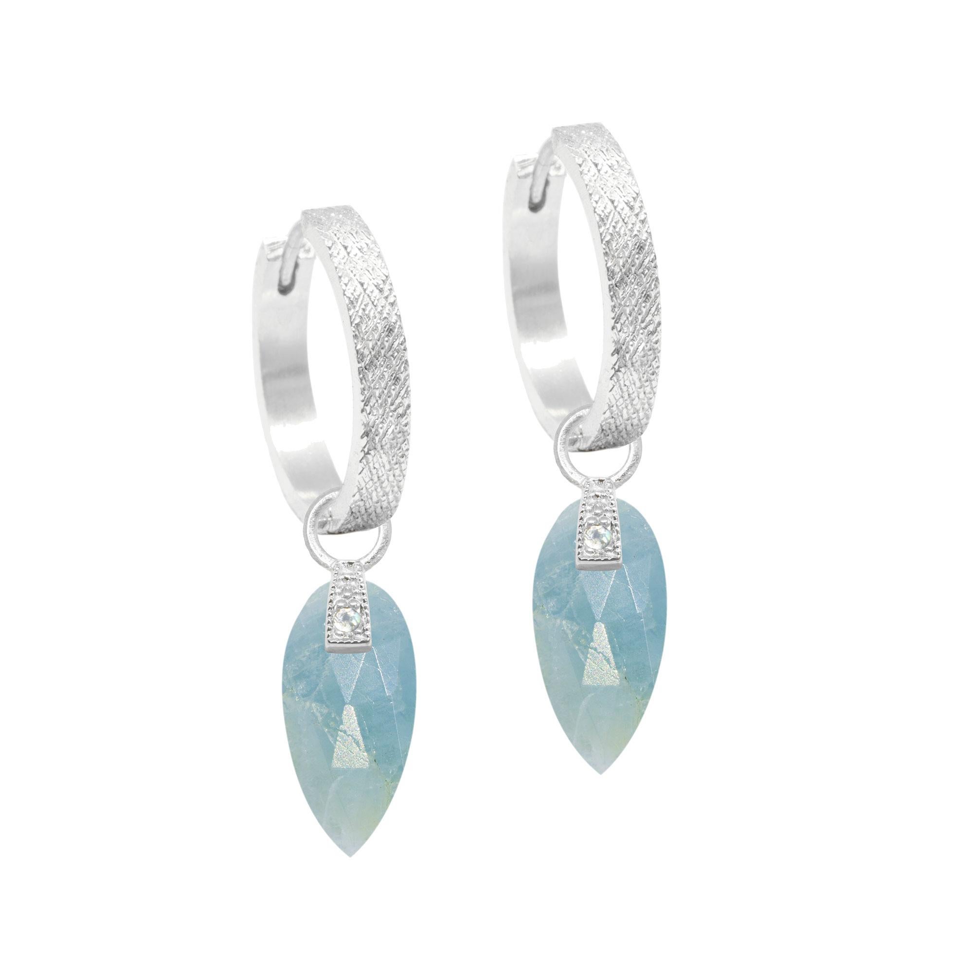 The perfect everyday style, especially when you want a pop of pale blue, the Angel Wings 15mm Silver Charms feature milky aquamarine drops dangling from a gemstone-studded bale.


Nina Wynn Design's patent-pending earrings have an element on the