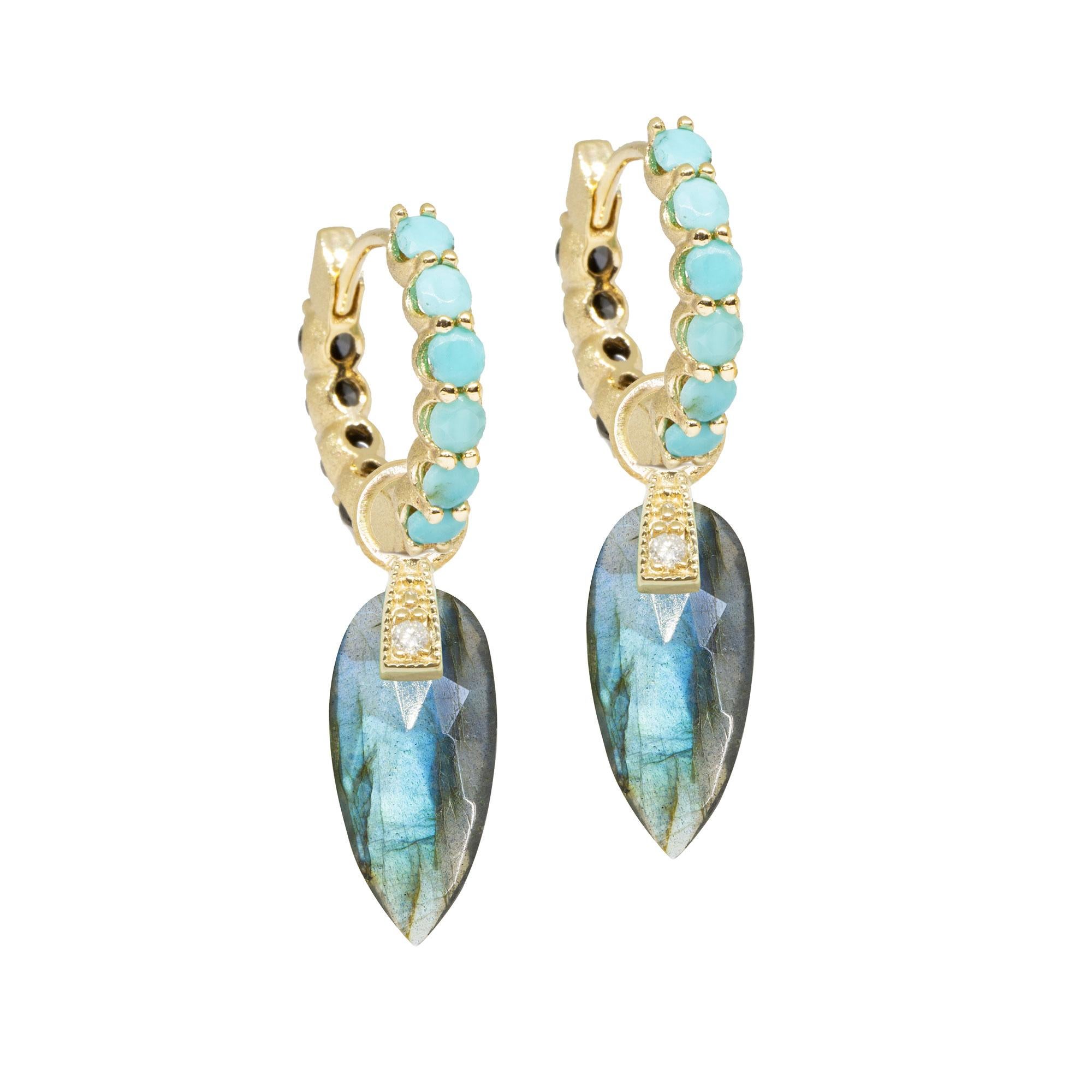 The perfect everyday style, especially when you want a pop of pale blue, the Angel Wings 15mm Gold Charms feature milky labradorite drops dangling from a diamond-studded bale.
Nina Nguyen Design's patent-pending earrings have an element on the back