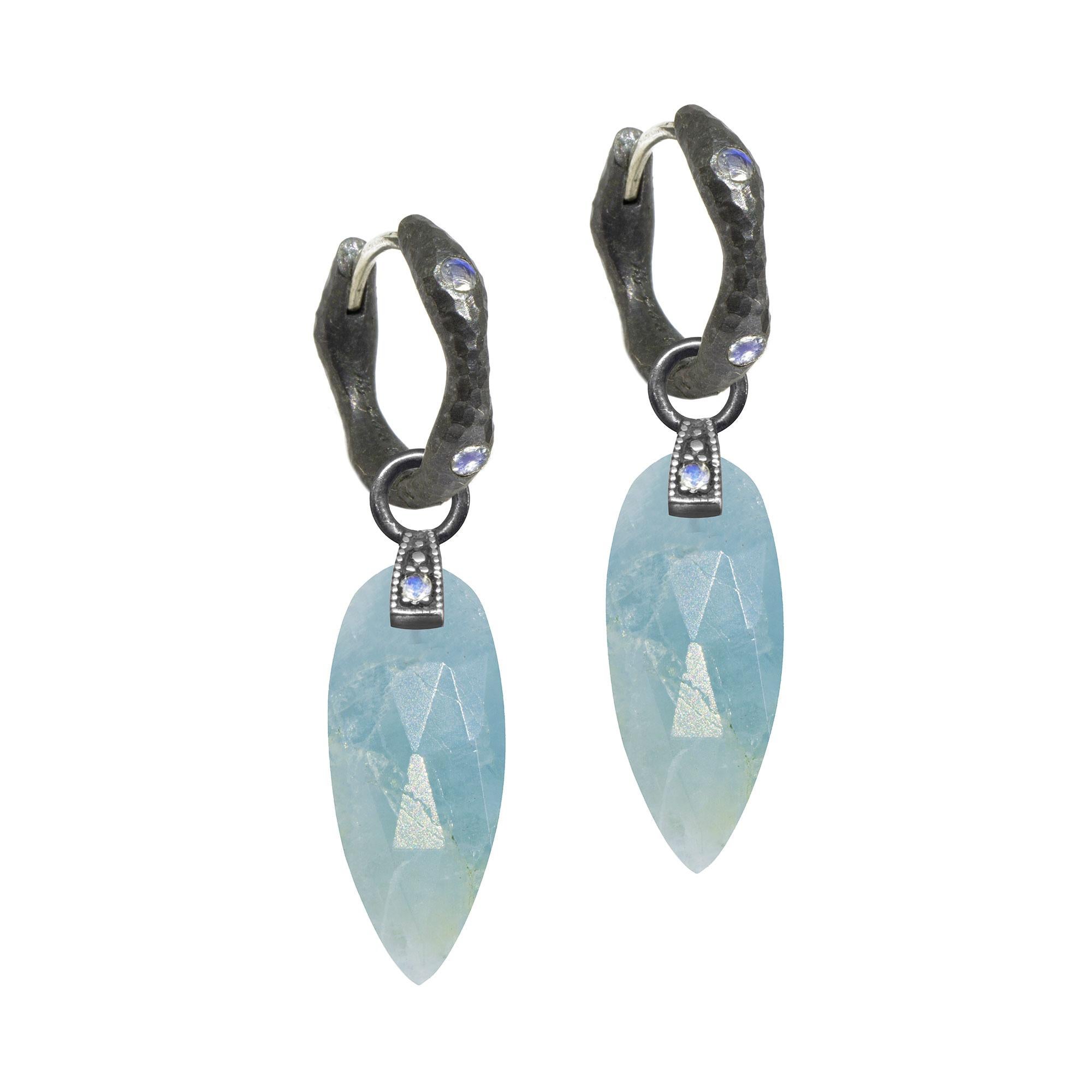 The perfect everyday style, the Angel Wings 20mm Oxidized Charms feature aquamarine drops dangling from a gemstone-studded bale.
Nina Nguyen Design's patent-pending earrings have an element on the back of the stud or charm to allow these pieces to