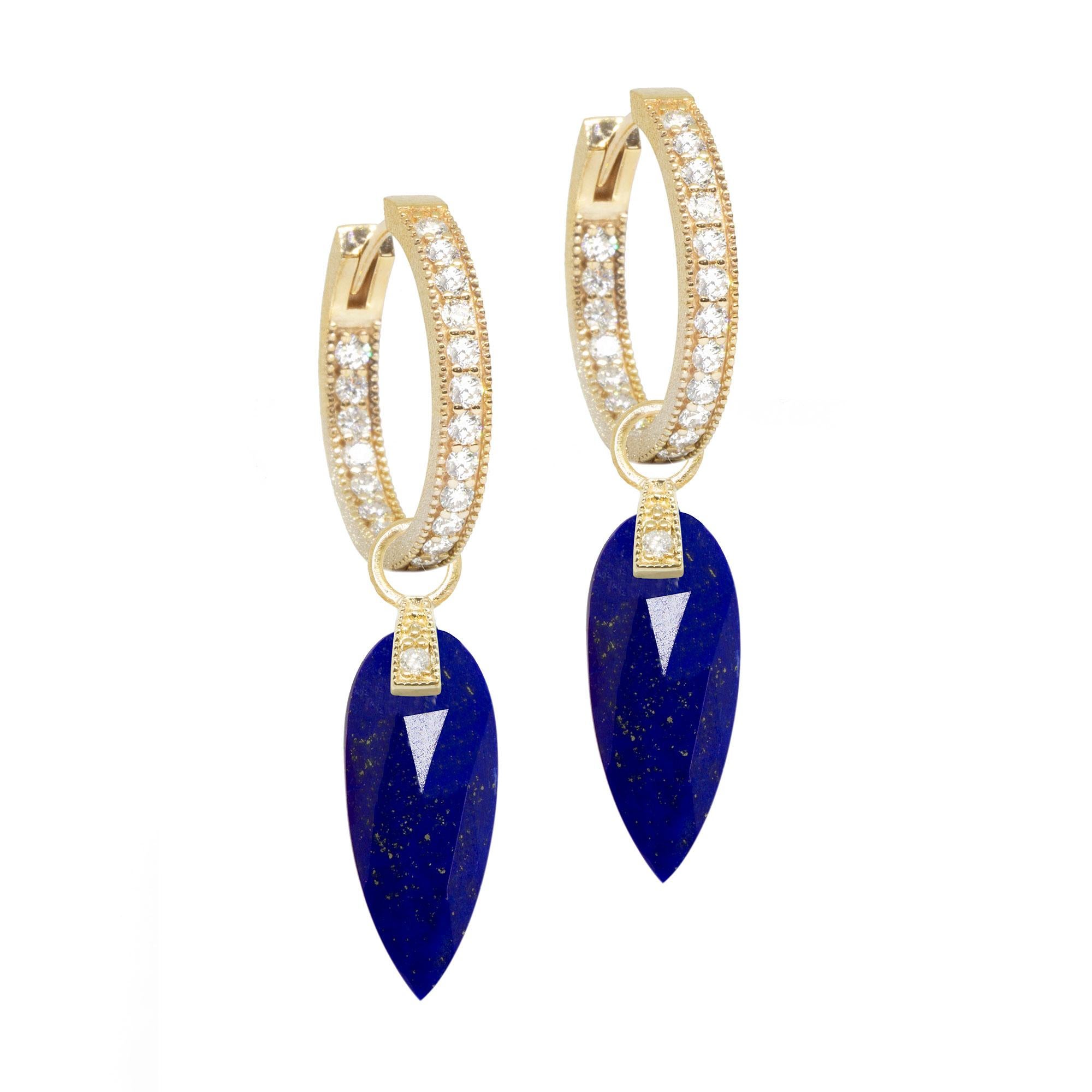 The perfect everyday style, the Angel Wings 20mm Gold Charms feature lapis drops dangling from a gemstone-studded bale.

Nina Nguyen Design's patent-pending earrings have an element on the back of the stud or charm to allow these pieces to