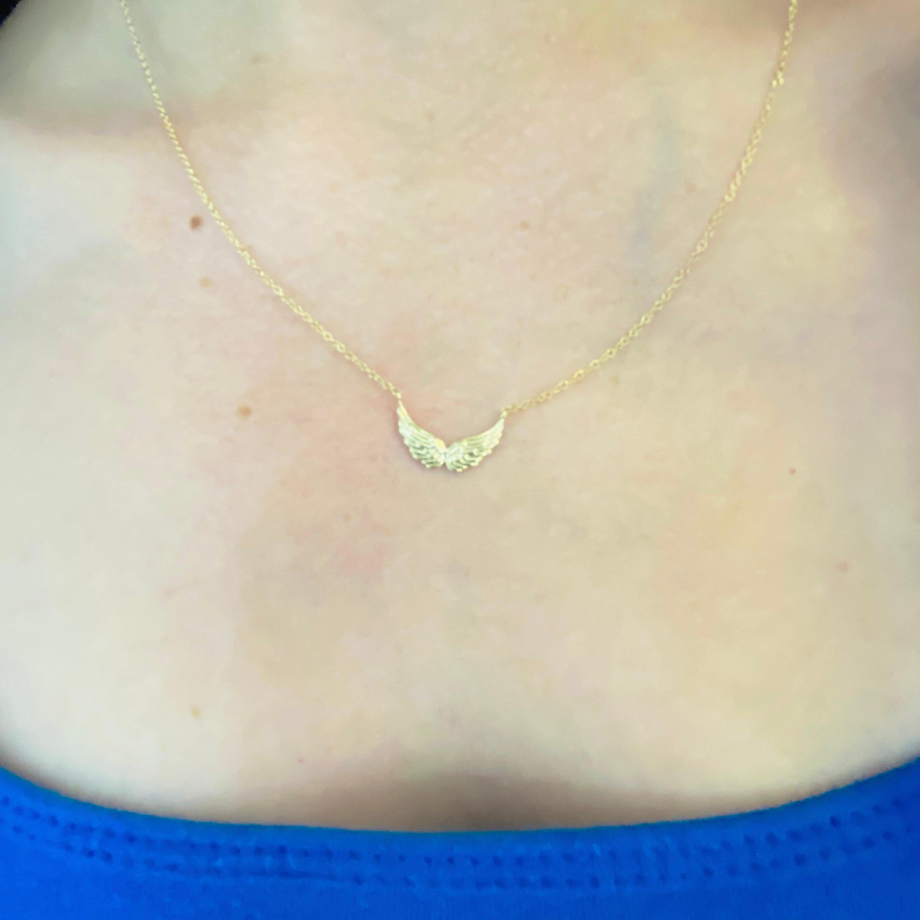 This gorgeous 14k yellow gold angel wings pendant is sure to put a smile on anyone's face! This necklace looks beautiful worn by itself and also looks wonderful in a necklace stack. Wear it as a reminder of the angels in your life and those watching