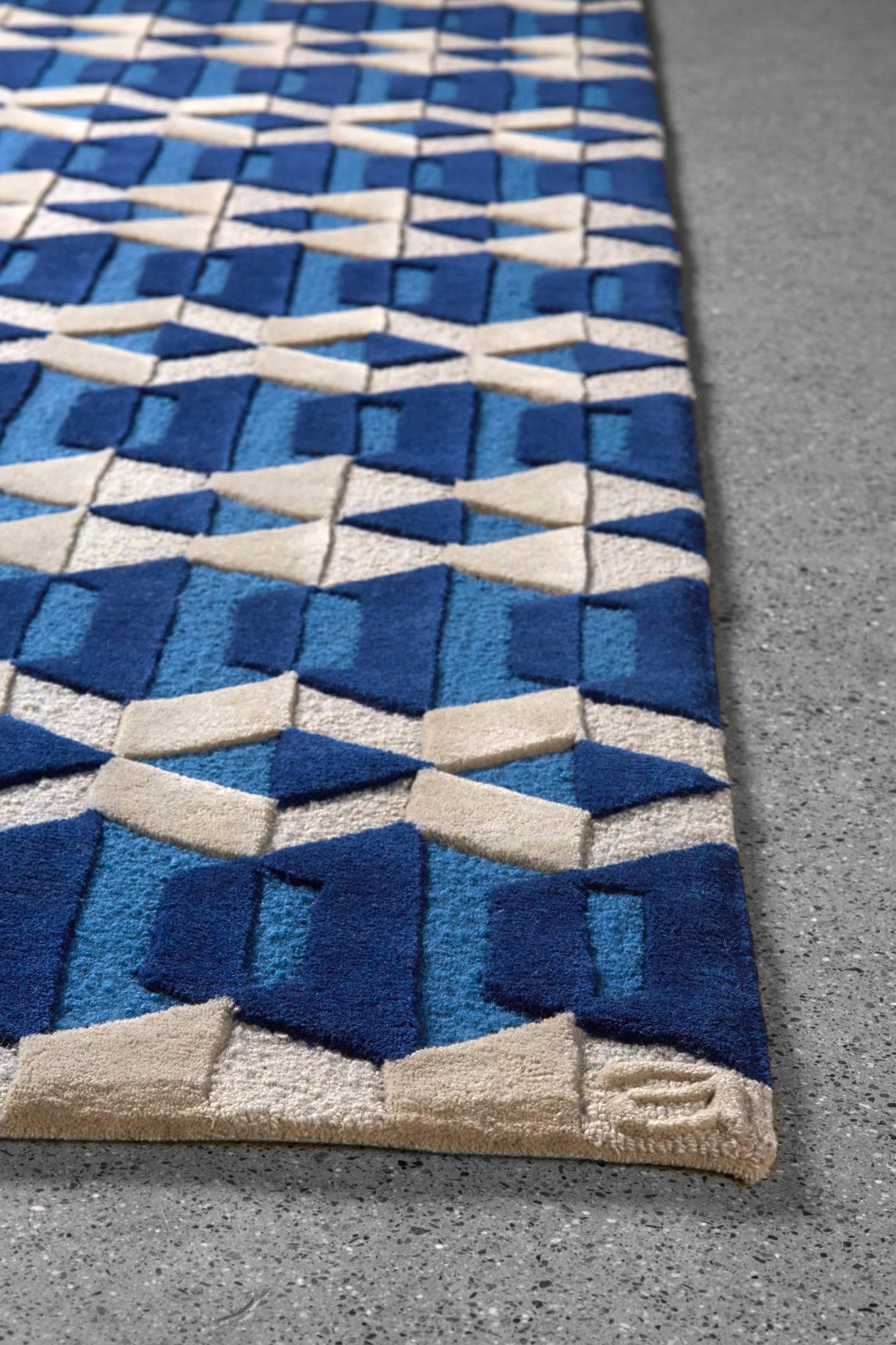 Inspired by traditional Swedish textiles and Craft; the Garbo/Sapphire area rug by Angela Adams features simple geometric shapes and fine, meticulous craftsmanship. The Garbo design blends order and geometry with rich texture and color in Sapphire,