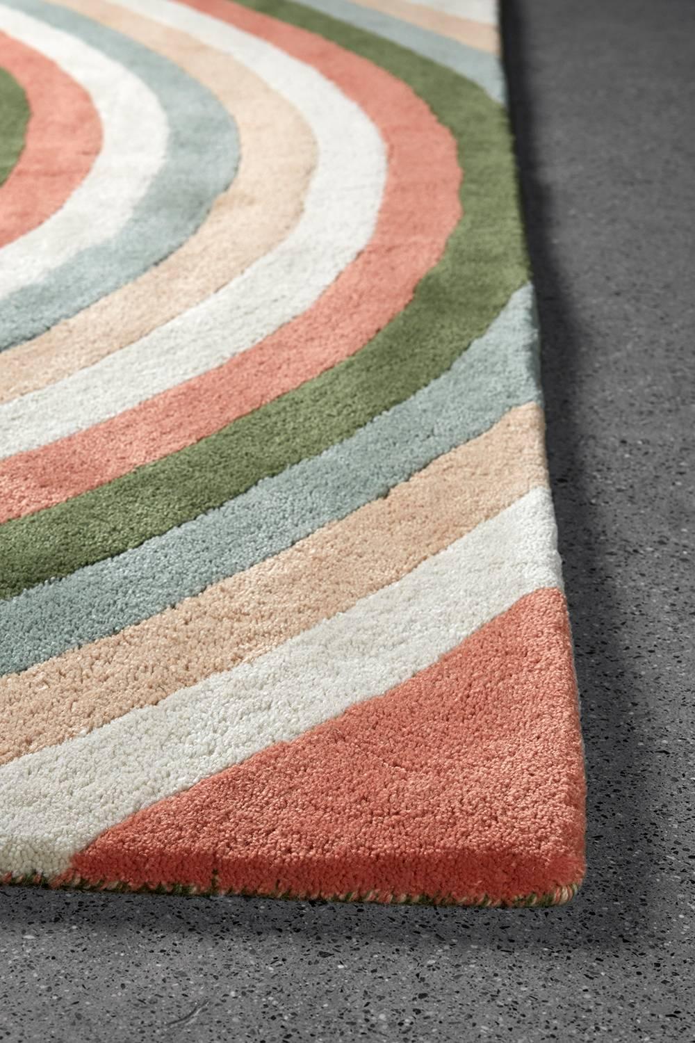 The simplicity of the Angela Adams Infinity / Daylight area rug invites us to stop and consider how a design can influence how we feel. Does the repeating pattern of concentric circles make you feel solitary and peaceful? Does it awaken your senses