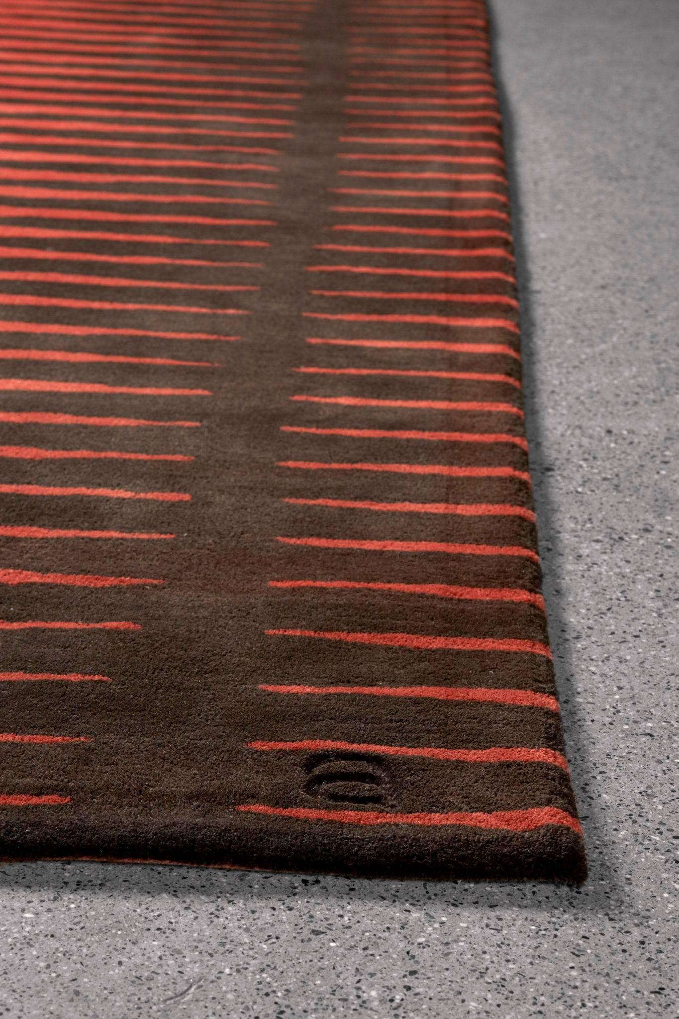 The Spock / Mars area rug in rich red and brown, features a futuristic spin on a Classic geometric pattern, bringing to life vibrant energy fields in planetary colors. This design is a tribute to Mr. Spock of Star Trek, for his wisdom, integrity and
