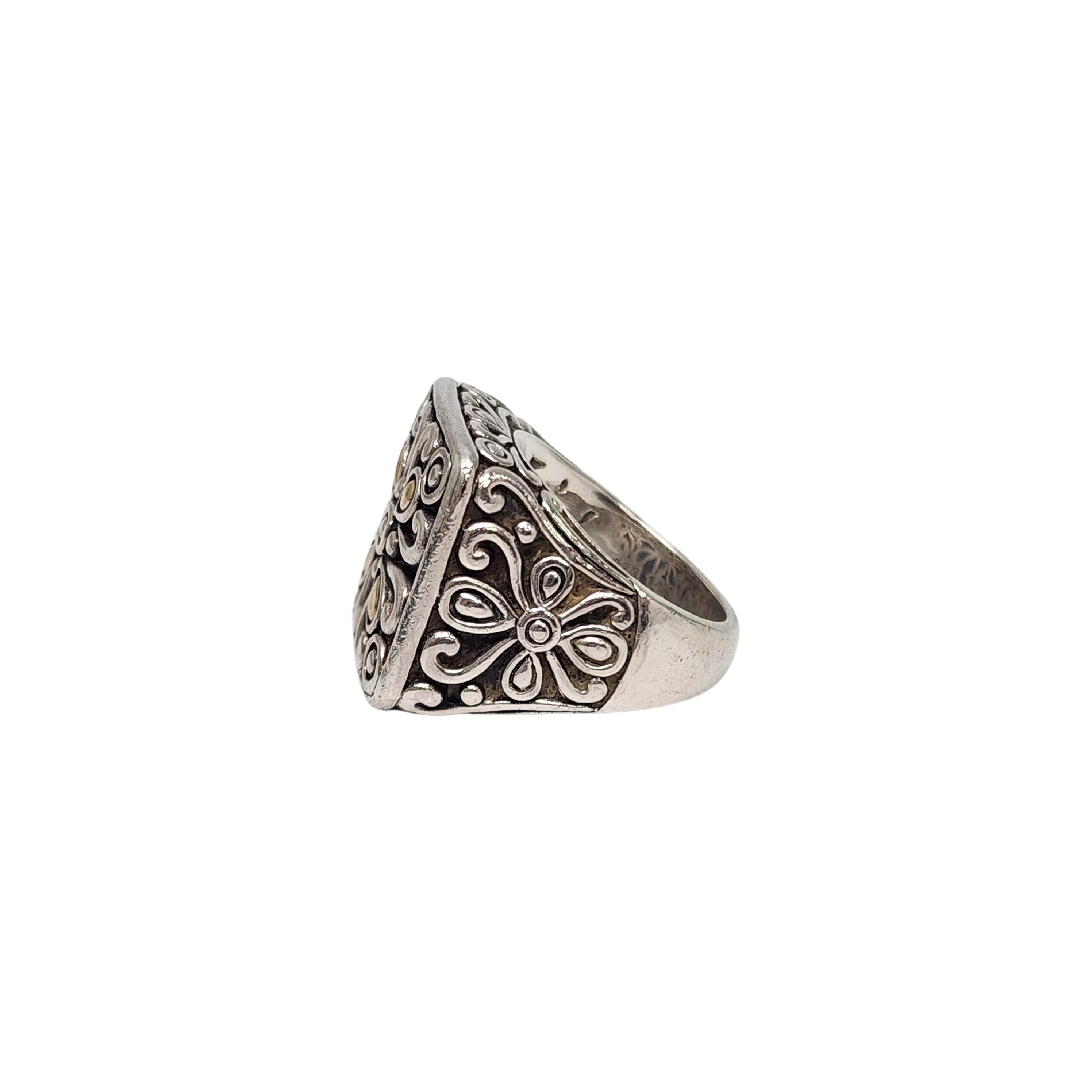 Sterling silver 14K yellow gold accent Bali ring by Angela by John Hardy.

Size 6

An affordable line by John Hardy, this Balinese inspired ring features a large square front with yellow gold teardrop accents.

Measures approx 3/4