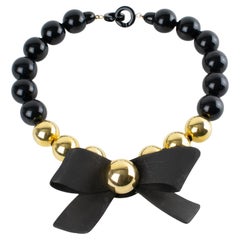Angela Caputi Black and Gold Resin Necklace with Oversized Bow