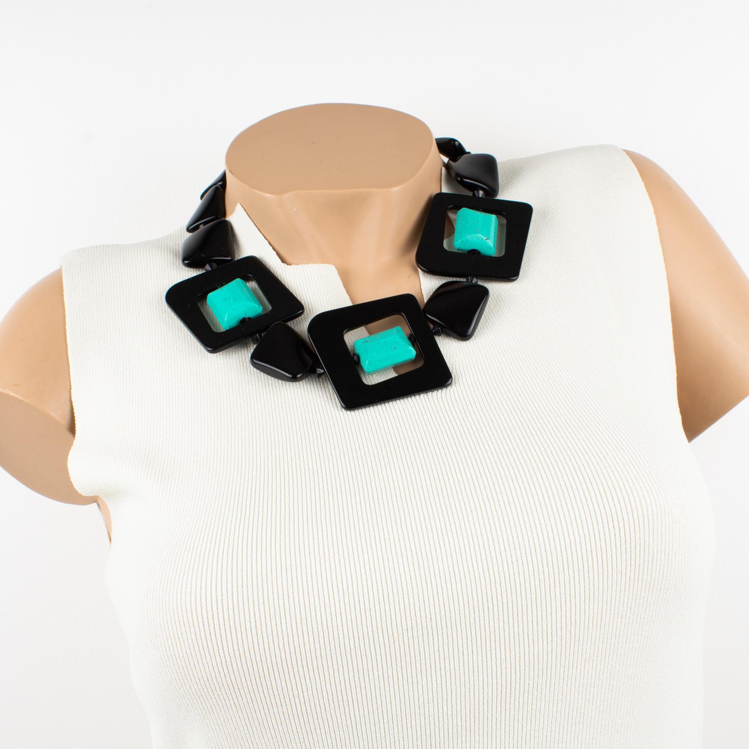 Lovely Angela Caputi, made in Italy resin choker necklace. Working on black and turquoise contrast, this necklace features chunky carved pebbles beads with three square-shaped donut beads with rotating turquoise beads. Her matching of colors is