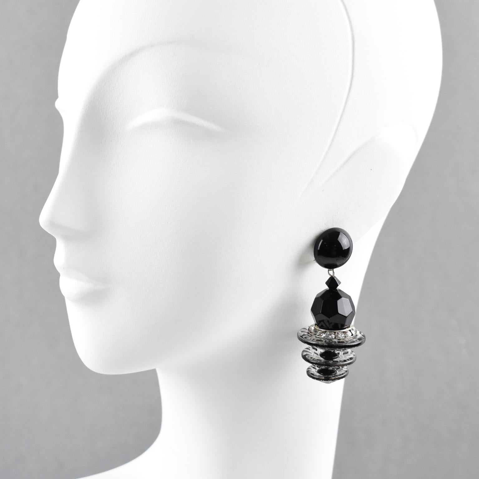 Stunning Angela Caputi, made in Italy resin clip-on earrings. Oversized dangling design with black elements in a cascading shape, contrasted with clear beads with black carving and clear crystal rhinestones ring. Her matching of colors is always