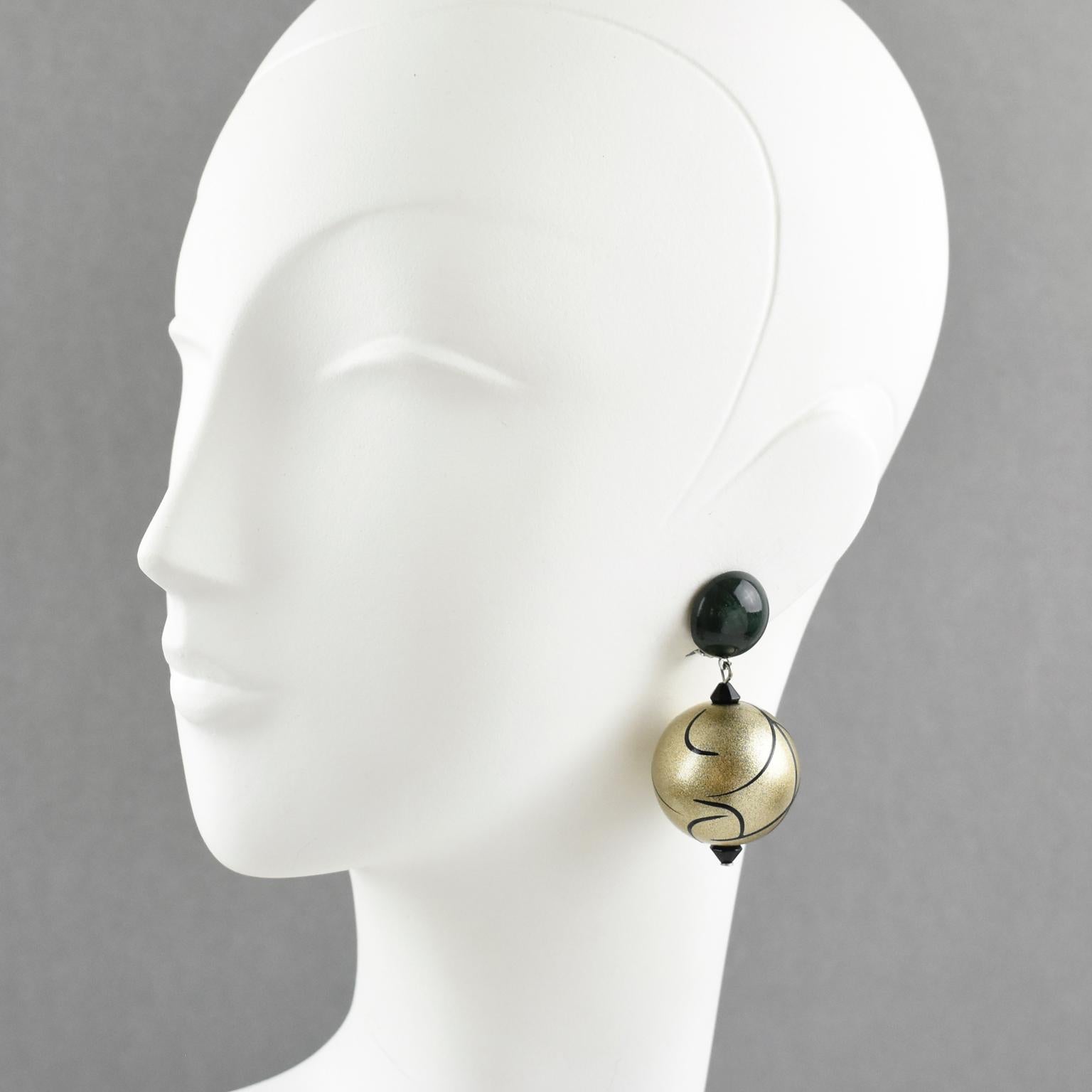 Elegant Angela Caputi, made in Italy resin clip-on earrings. Dangling shape with forest green marble color contrasted with pale gold resin ball bead all wrapped around with black lines. Her matching of colors is always extremely classy, perfect for