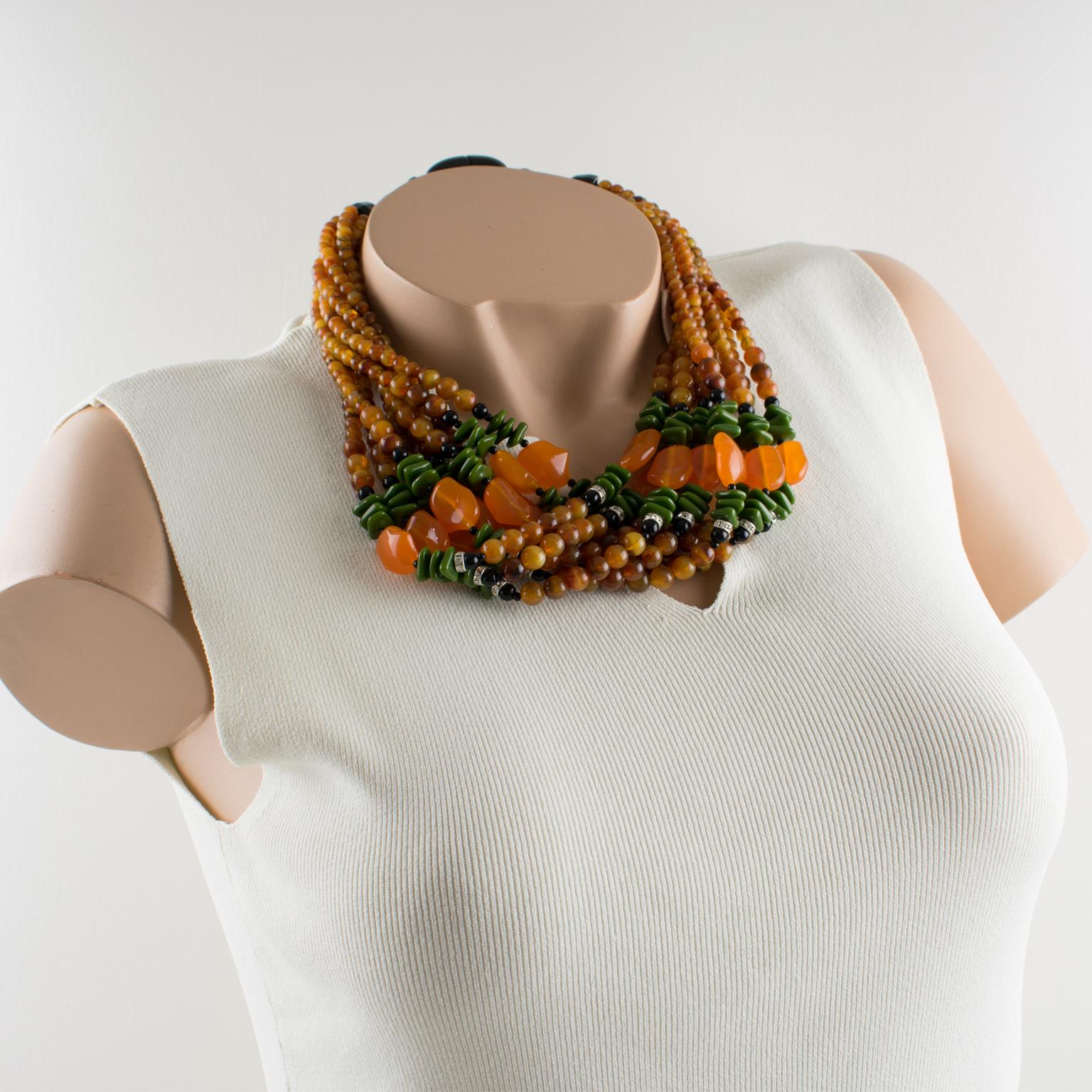 Striking Angela Caputi, made in Italy multiple strands beaded necklace. Three colors resin beads with nine strands. Assorted color range with yellow saffron marble, olive green, translucent orange, and black and compliment with clear rhinestones