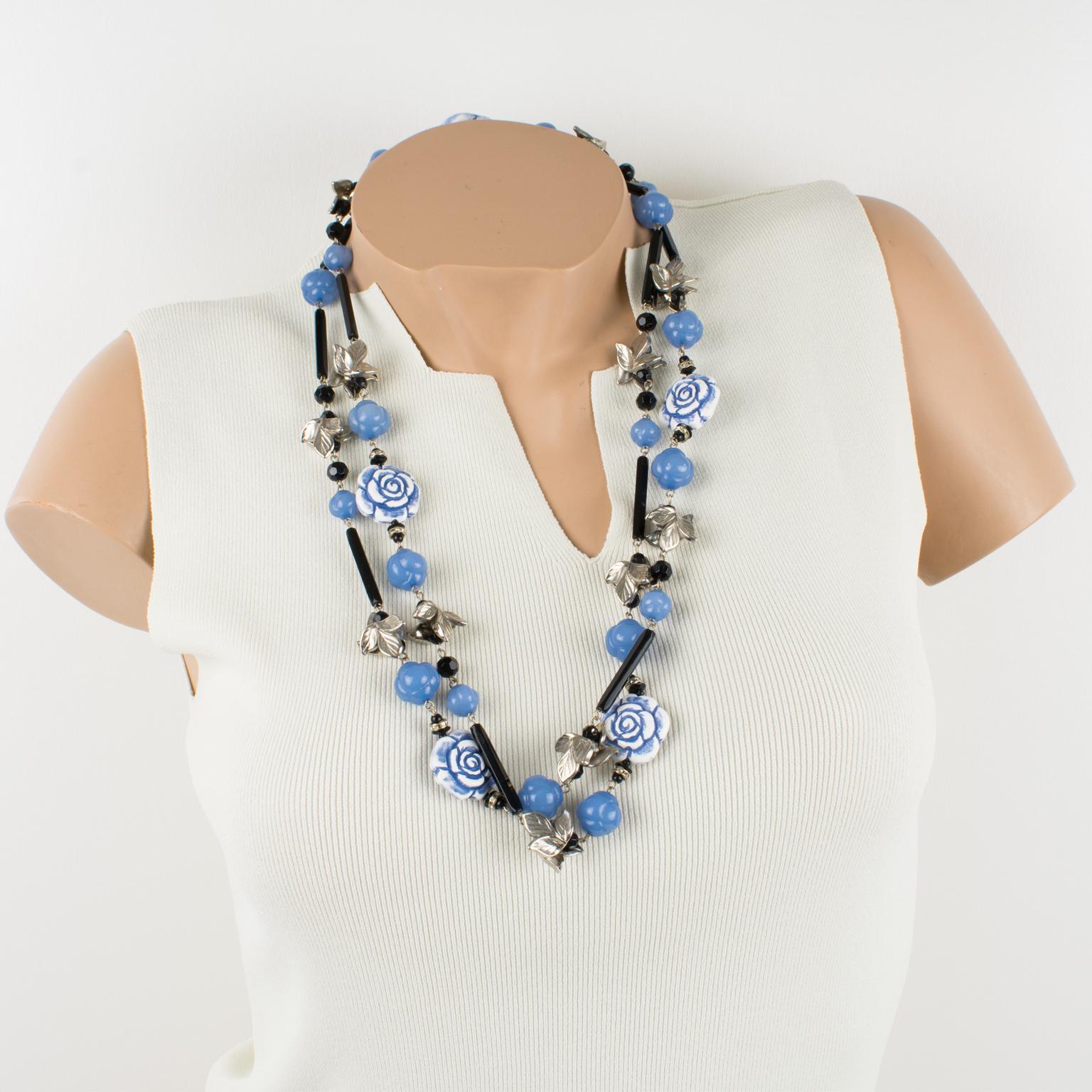 This elegant Angela Caputi necklace features a romantic-inspired extra-long design built with blue-white carved resin roses, lavender-blue beads, and silvered resin leaves. Her matching of colors is always bold and  classy.
As you know, Caputi