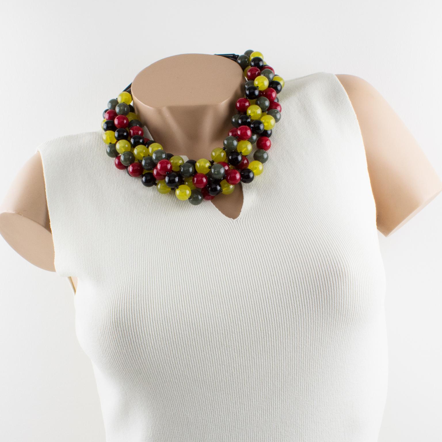 Charming Angela Caputi, made in Italy resin choker beaded necklace. Oversized fruit salad multi-strand design with grape seed size beads in burgundy red, black, blonde yellow, and sage green colors. Her matching of colors is always extremely classy,