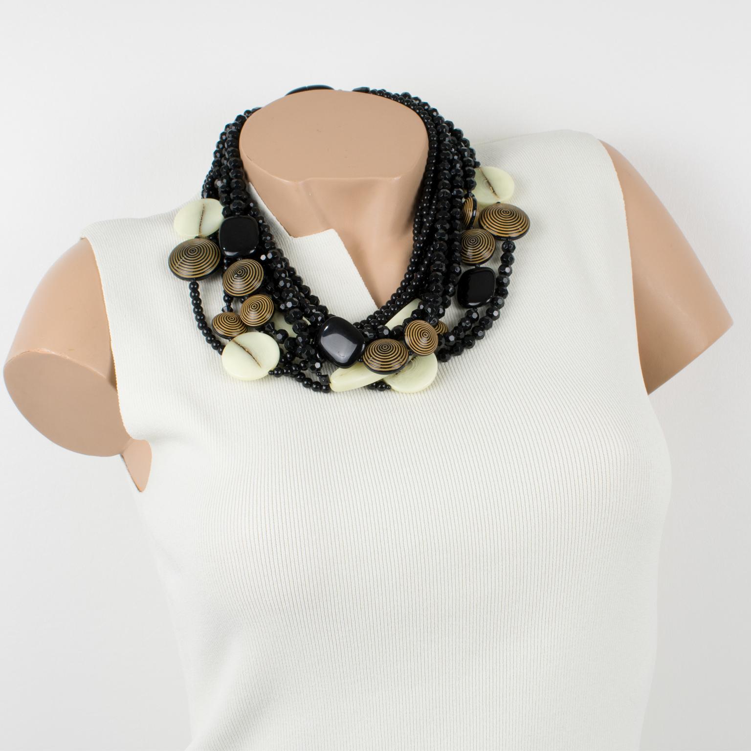 This refined Angela Caputi, made-in-Italy resin choker necklace features an oversized multi-strand design with a dominant black color contrasted with chocolate brown and cream-white tones. The black resin beads are faceted and are complemented by