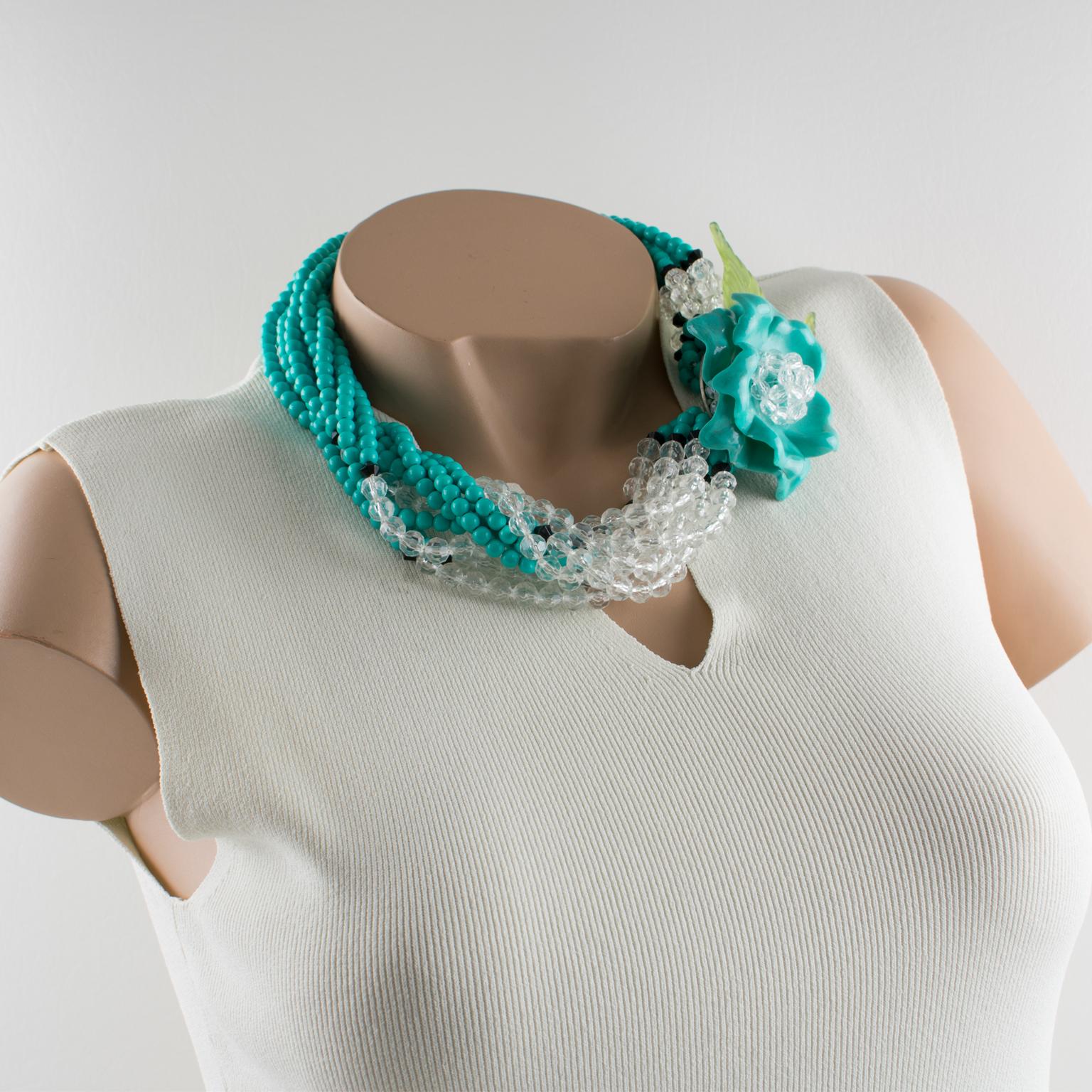 Lovely Angela Caputi, made in Italy beaded necklace. Large multi-strand resin beads with an oversized dimensional flower pendant on the side. Assorted colors of turquoise blue, black, transparent, and light green. Multi-strand of tiny turquoise-blue