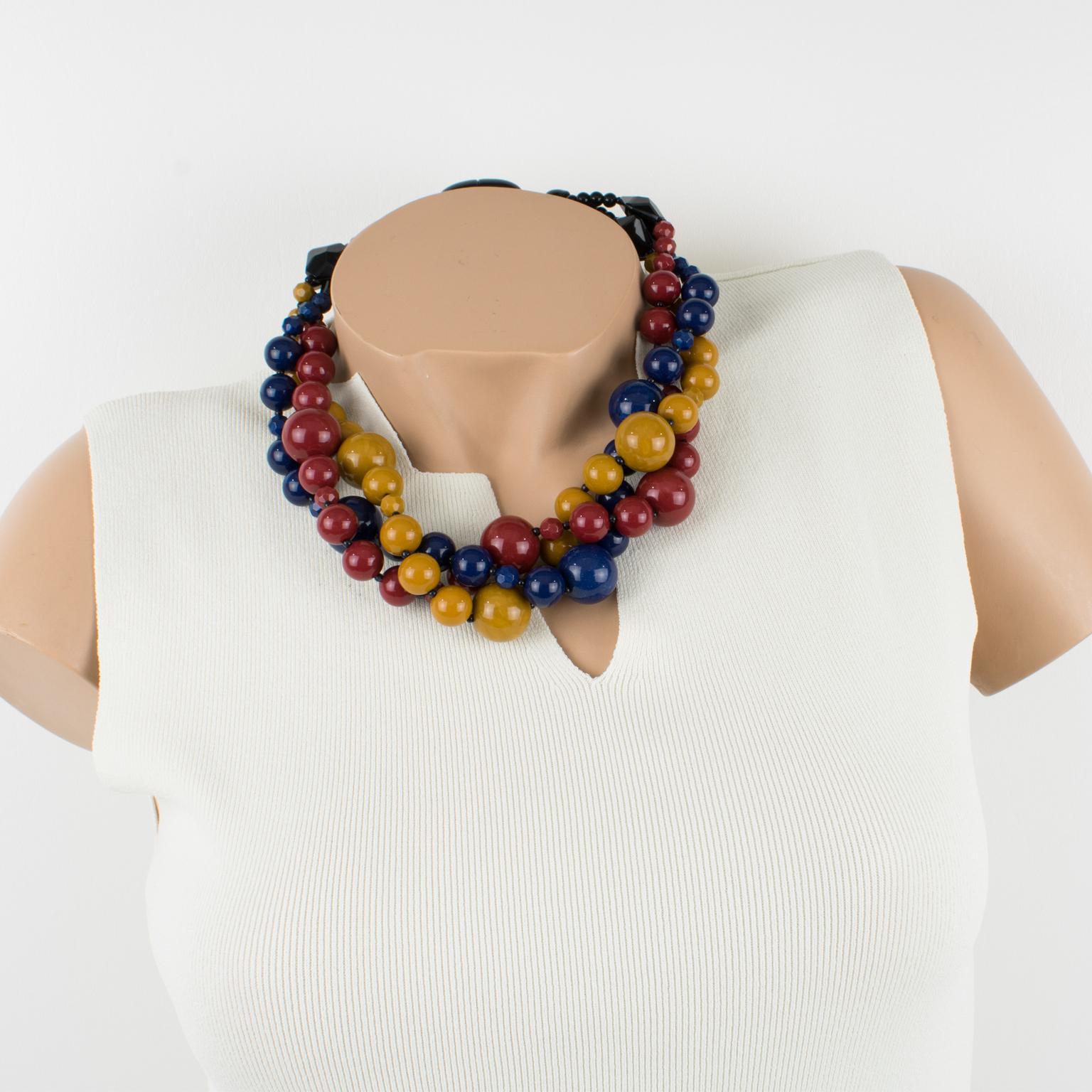 This charming Angela Caputi, made in Italy resin choker beaded necklace features an oversized multi-strand design with assorted size beads in burgundy red, black, yellow Dijon mustard, and navy blue colors. Her matching colors are always extremely