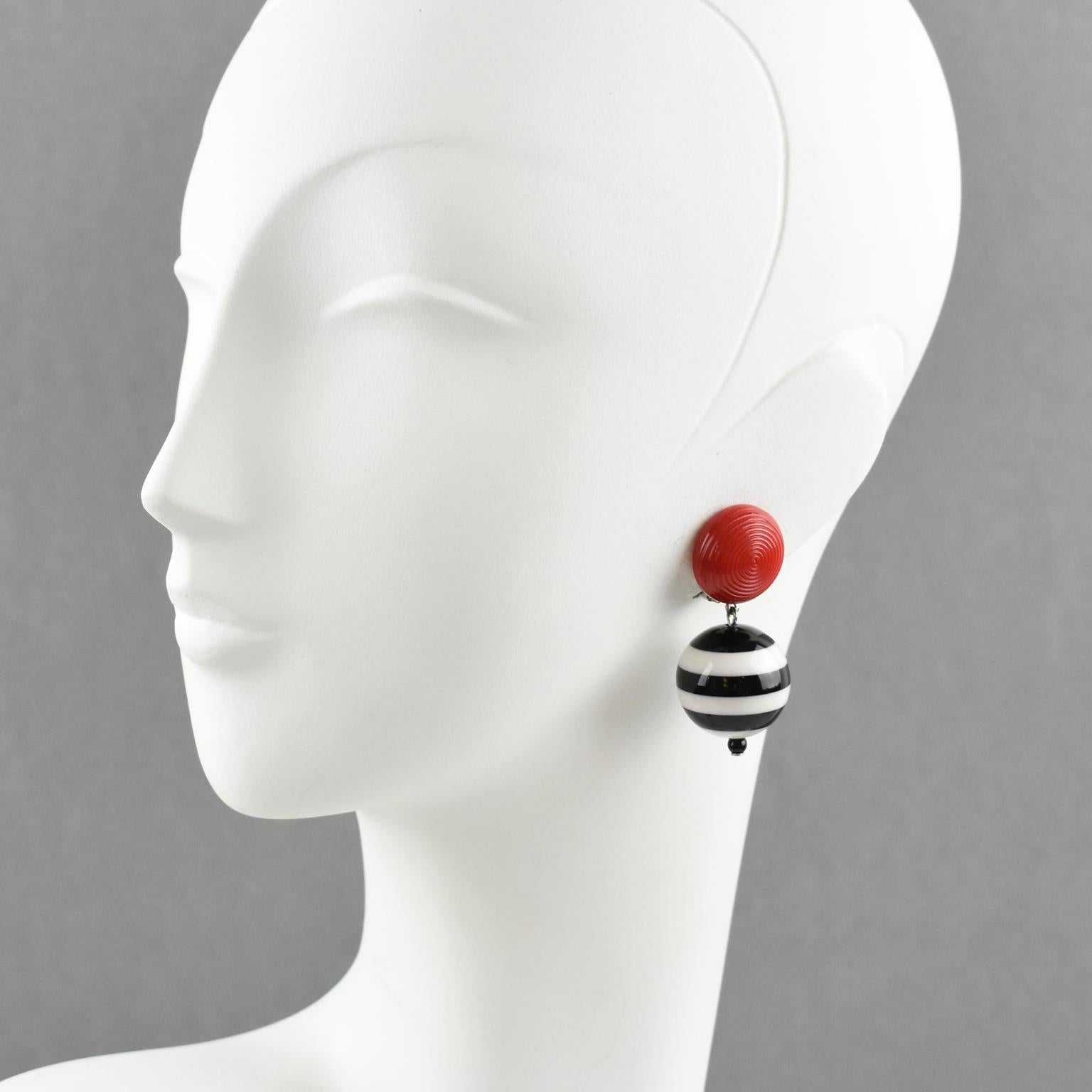 So cool Angela Caputi, made in Italy resin clip-on earrings, with a nautical flair. Dangling shape with black and white striped round bead contrasted with a carved bright red half bead. Her matching of colors is always extremely classy, perfect for