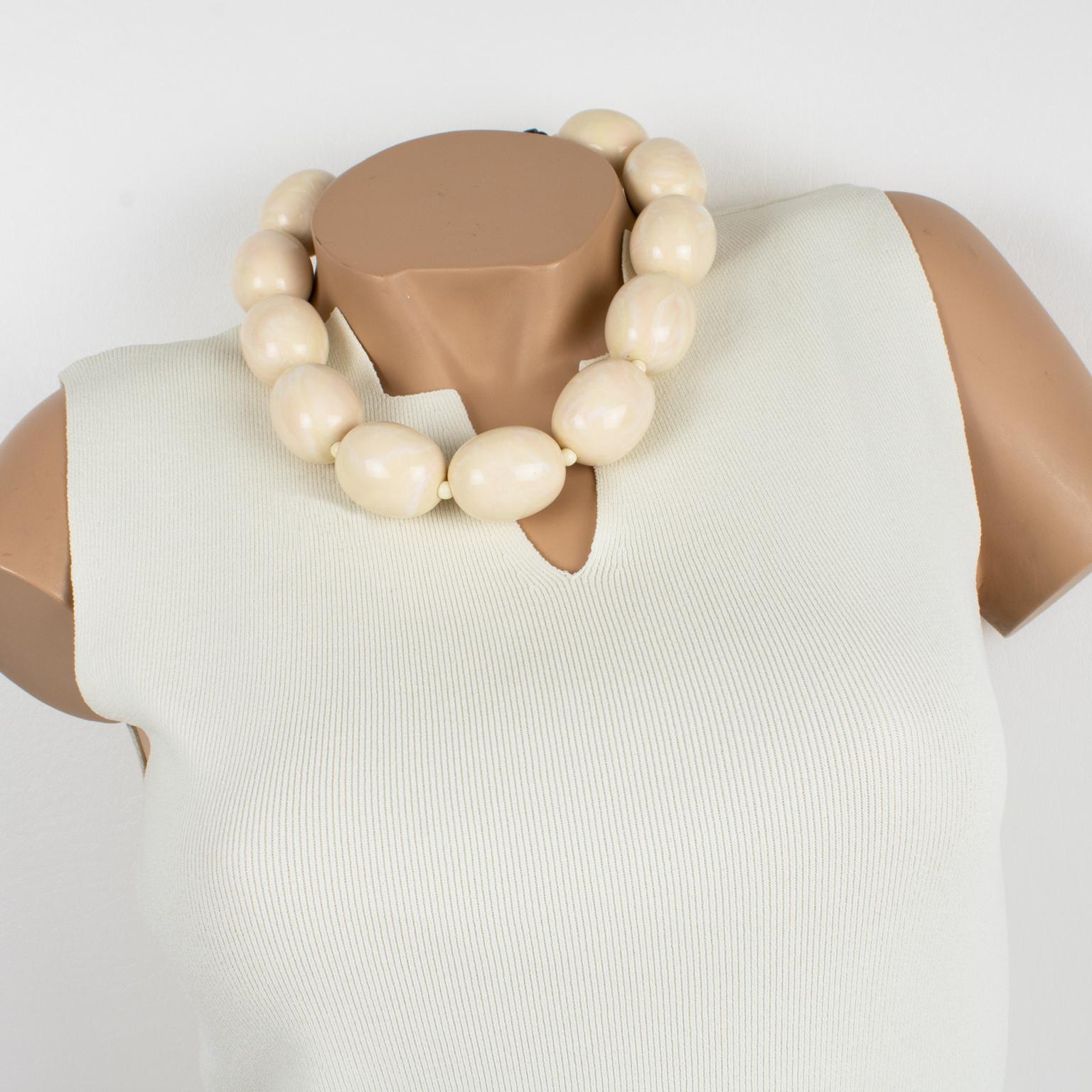 Classy Angela Caputi, made in Italy resin choker necklace. This necklace features a minimalist shape with oversized ovoid beads in ivory color with a pink overtone swirling. Her matching of colors is always extremely classy, perfect for casual and