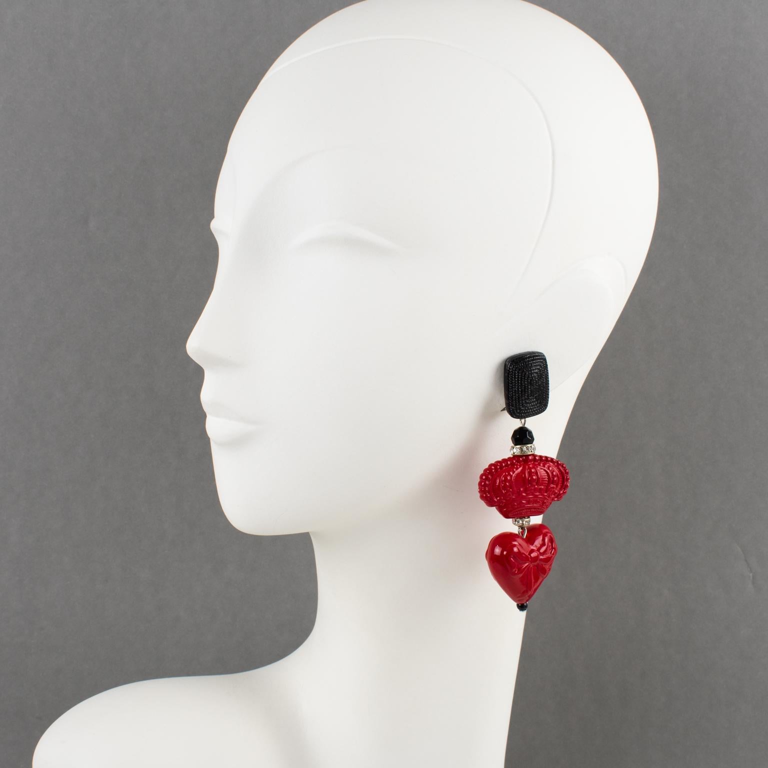 Gorgeous Angela Caputi, made in Italy resin clip-on earrings. Oversized dangling shape with red and black elements compliments with tiny crystal rhinestones ring. The red elements are a dimensional heart with a carved bow and a carved crown. Her