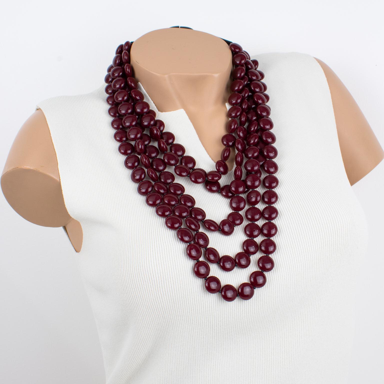 This superb Angela Caputi, made-in-Italy resin choker necklace features an oversized multi-strand design with lovely red Bordeaux and black colors. The geometric flat and slightly domed rounded pebbles (they look like Smarties) are built in five