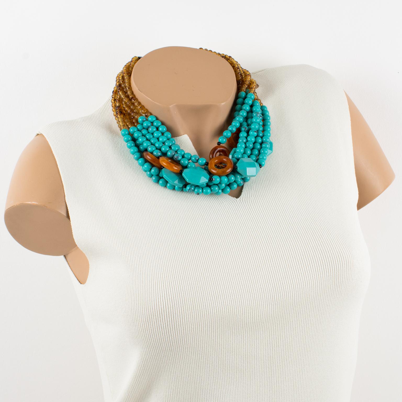 Angela Caputi made this elegant resin-beaded choker necklace in Italy. It features an oversized multi-strand design with a dominant turquoise color contrasted with rootbeer brown donut elements and tiny amber-like seed beads. Her assortment of