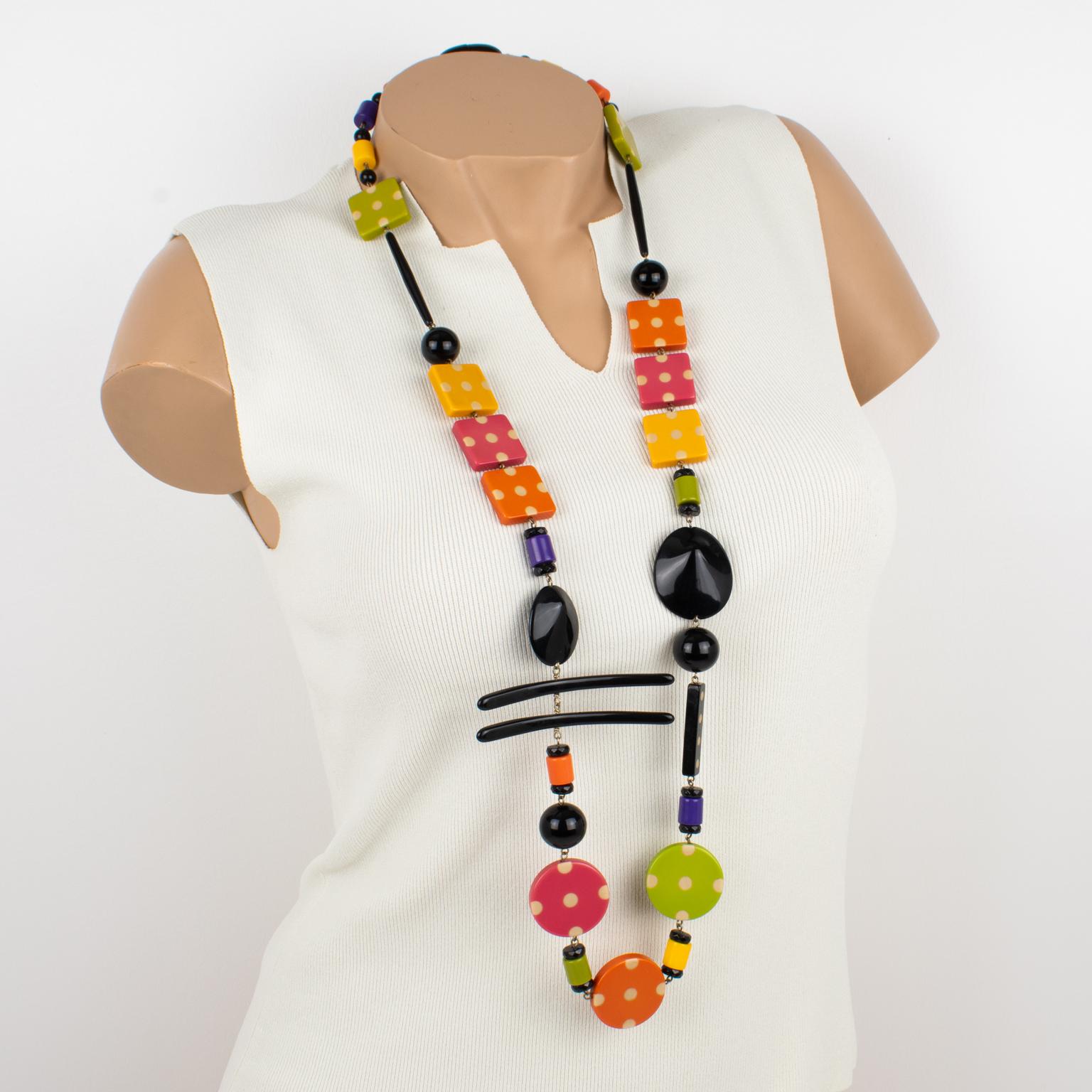 This gorgeous Angela Caputi, made-in-Italy resin and Lucite extra-long necklace has a playful design. The piece boasts geometric elements in a multicolor pattern with textures and different bead shapes. The asymmetrically constructed design features