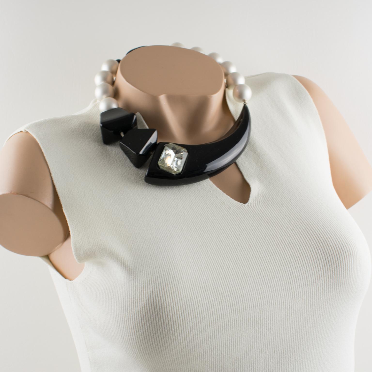 Stunning Angela Caputi, made in Italy resin choker beaded necklace. Working on black and white contrast, this necklace features asymmetric geometric elements. Pearlized white resin round beads ornate with a huge faceted true licorice black resin