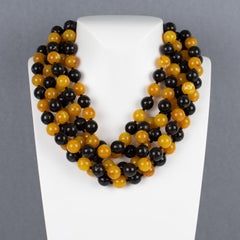 Angela Caputi Collana in resina a più fili con perline color mandarino e nero