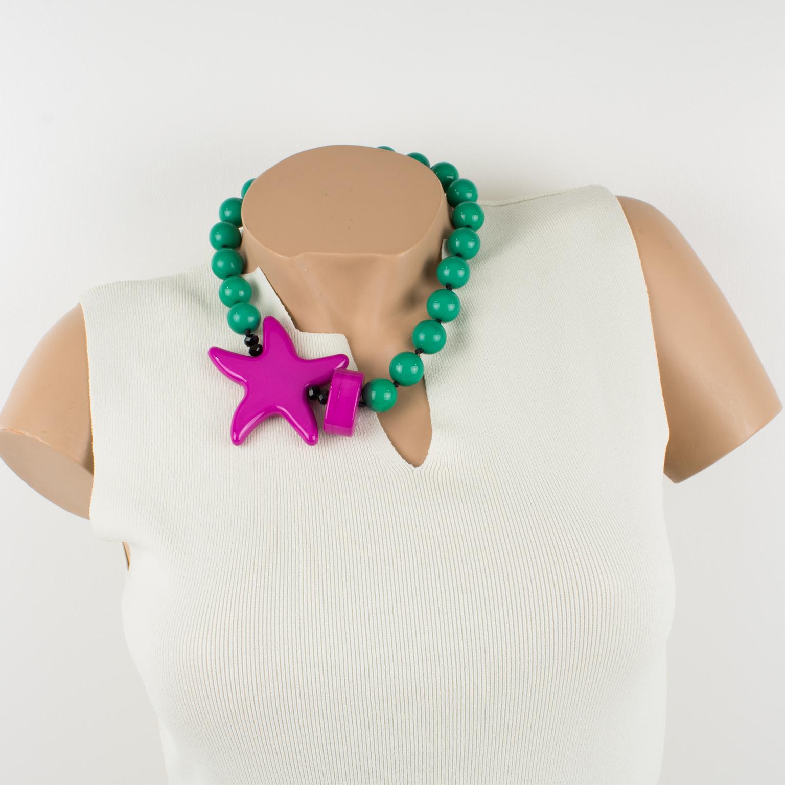 Elegant Angela Caputi, made in Italy resin choker necklace. Working on turquoise with hot pink contrast, this necklace features chunky rounded beads with a side carved starfish and pebble elements. Her matching of colors is always extremely classy,