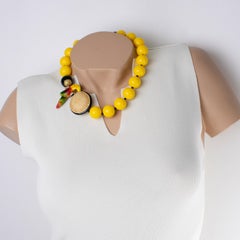 Angela Caputi Yellow Necklace with Carved Parrot and Giant Wicker Bead