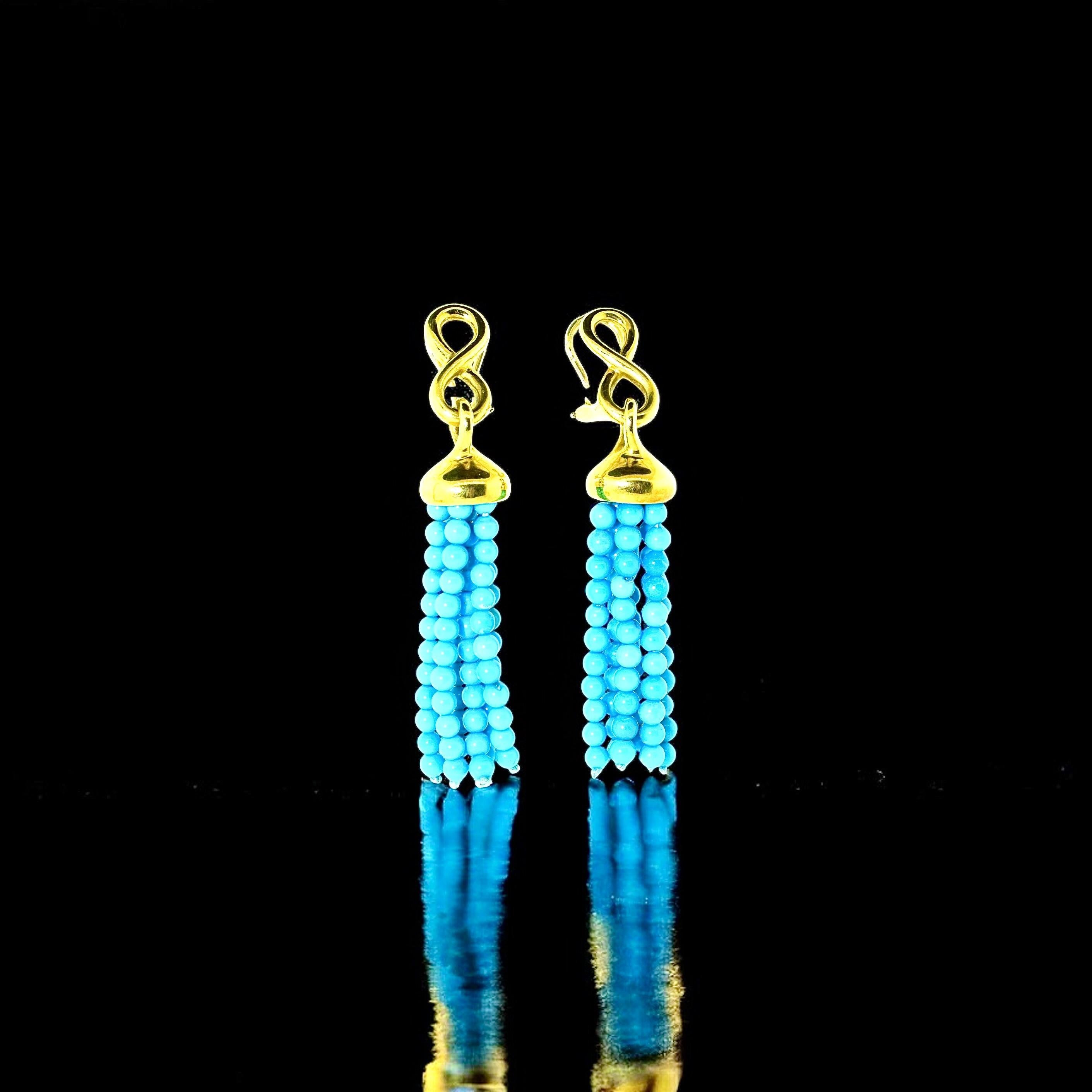 Angela Cummings, a major designer for Tiffany & Co. has made a fine pair of 18K and natural turquoise, from the now closed sleeping beauty mines, tassel drop earrings. These earrings are made with fine materials. They are long and unusual and not a