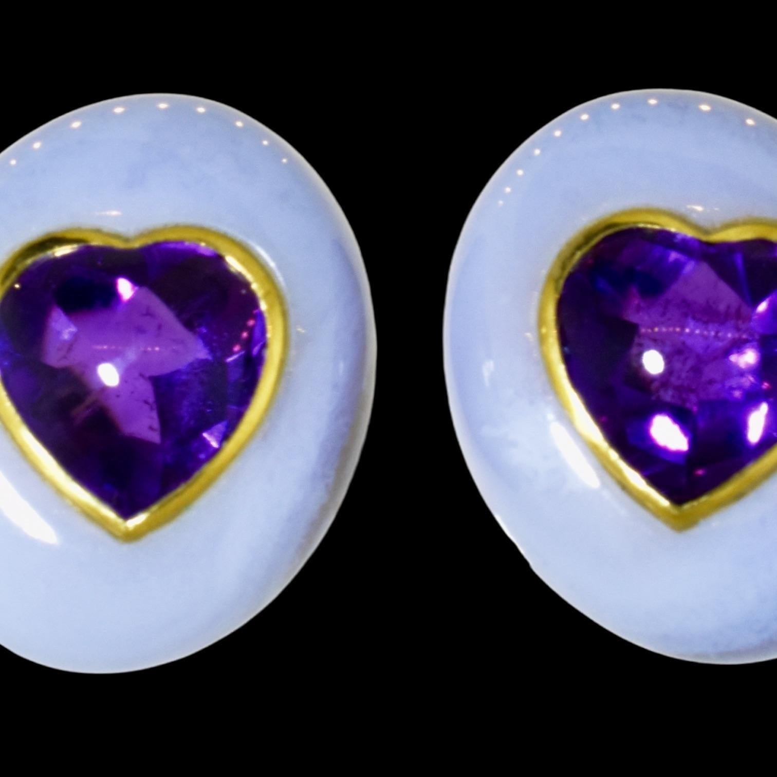 Angela Cummings 18K earrings. These remarkable 18K yellow gold, amethyst bezel set in very light blue natural chalcedony, these unusual earrings are by Angela Cummings.  They are slightly less than 1 inch in length and .75 inches in their width.